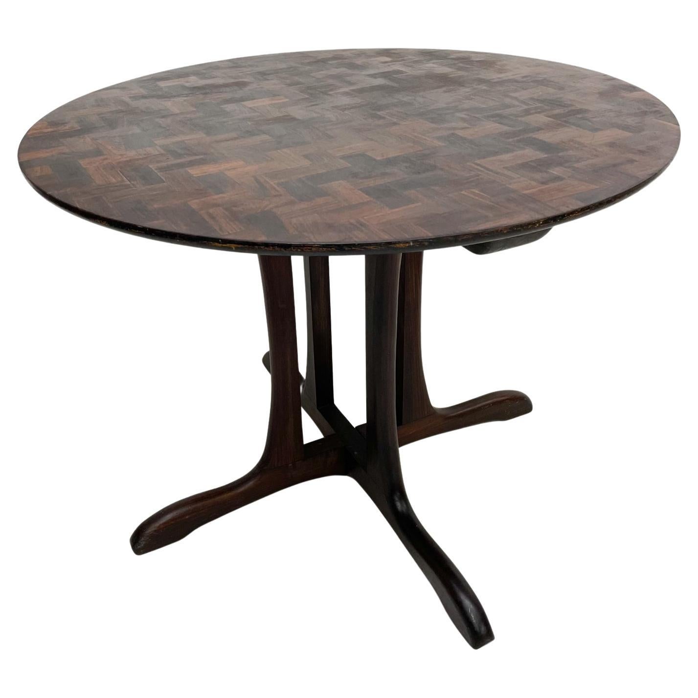 Round Dining TABLE exquisite exotic cocobolo wood marquetry designed by Don S Shoemaker Mexico 1960s
Shoemaker's Sling collection Mesa Redonda F12 produced by Señal his workshop.
Retains original maker label, Señal .
Measures: 39.25 diameter x