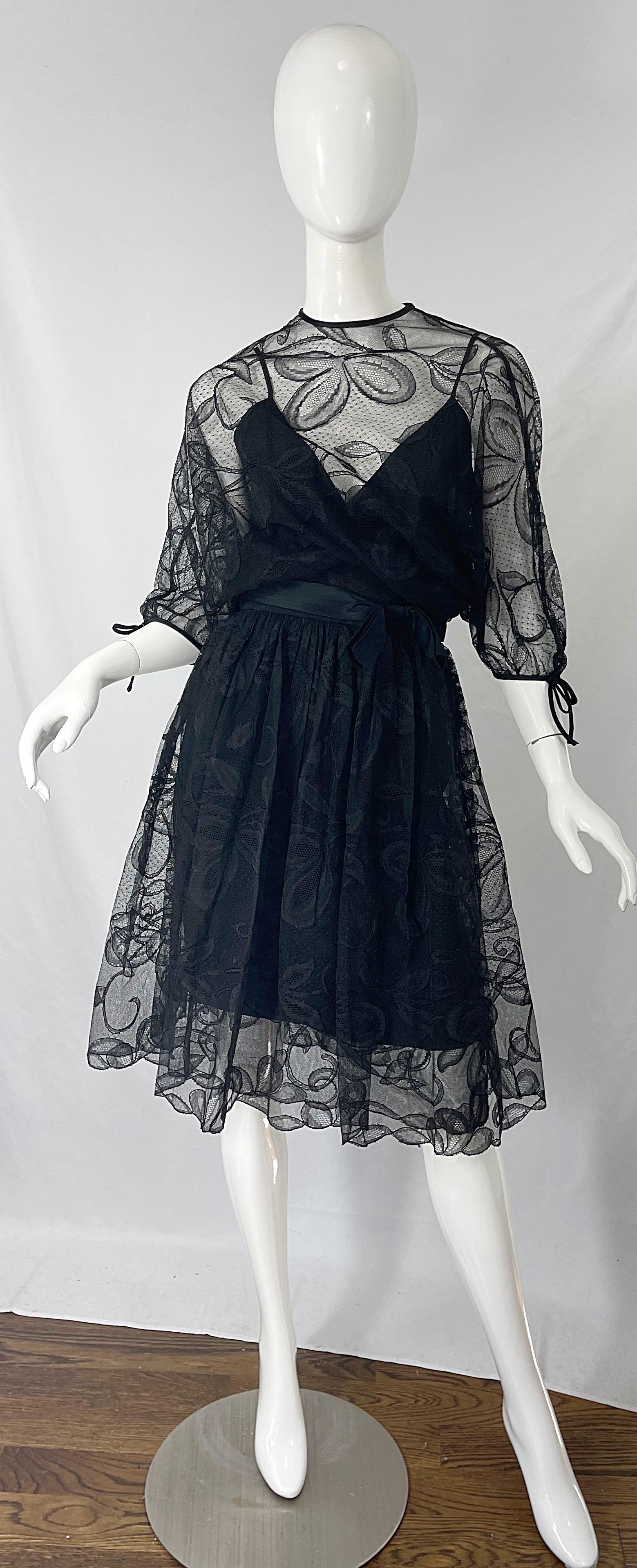 Chic mid 60s DONALD BROOKS black silk lace overlay 3/4 sleeves dress ! Features a spaghetti strap bodice with hidden metal zipper up the back. Lace overlay has 3/4 sleeves with bows at each cuff. Attached bow belt. Hidden snaps up the back. The