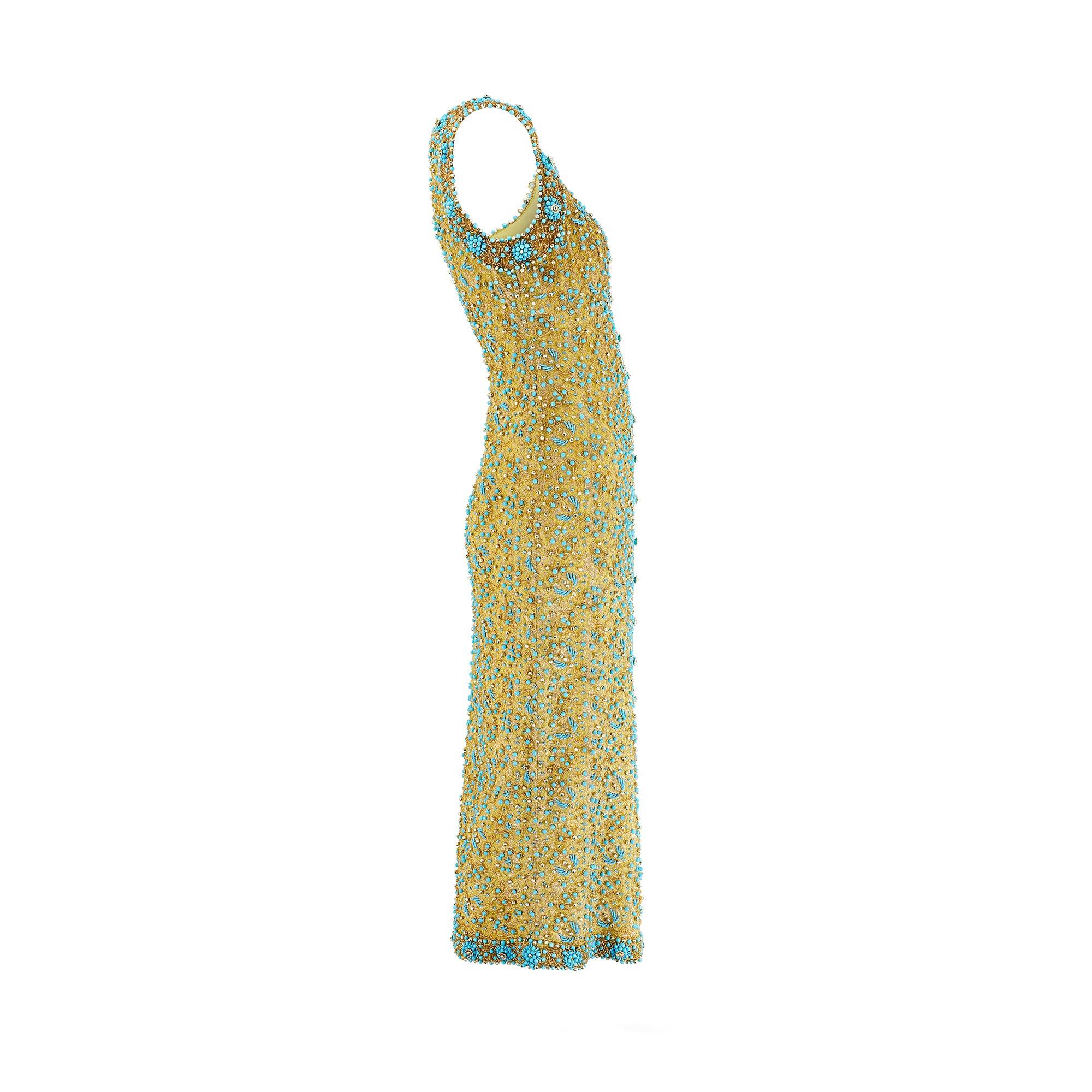 This is the second time we have had an exquisite 1960s gold and turquoise dress in at Circa.  This one is a slightly different size and design and although unlabelled, we are attributing it to Doreen Lok.  An absolute show-stopper, this ankle length