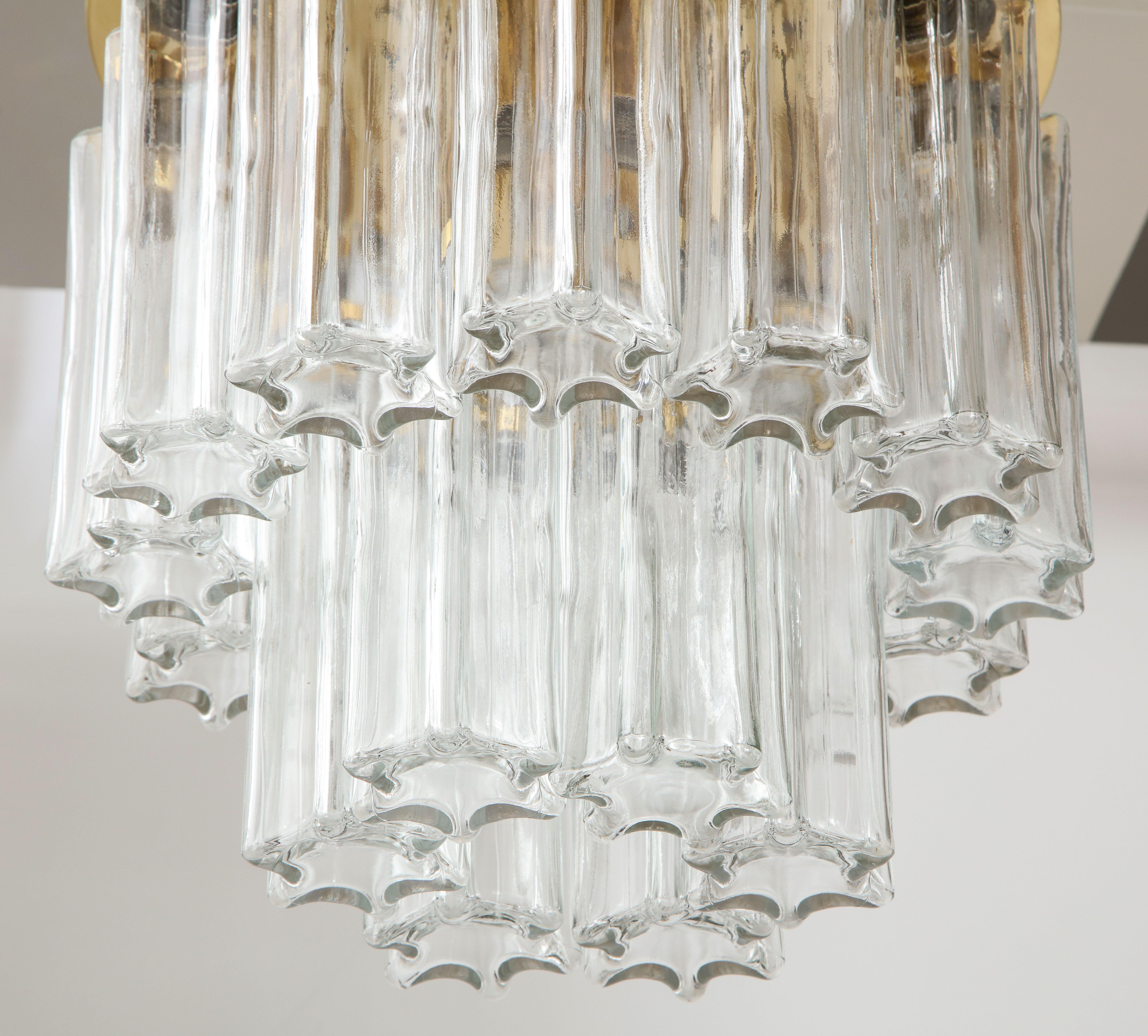 1960s flush mount ceiling fixture by Doria lighting company.
The textured star shaped glass tubes hook on to the polished brass fixture
which has three light sources.
The fixture has been newly rewired for the US.