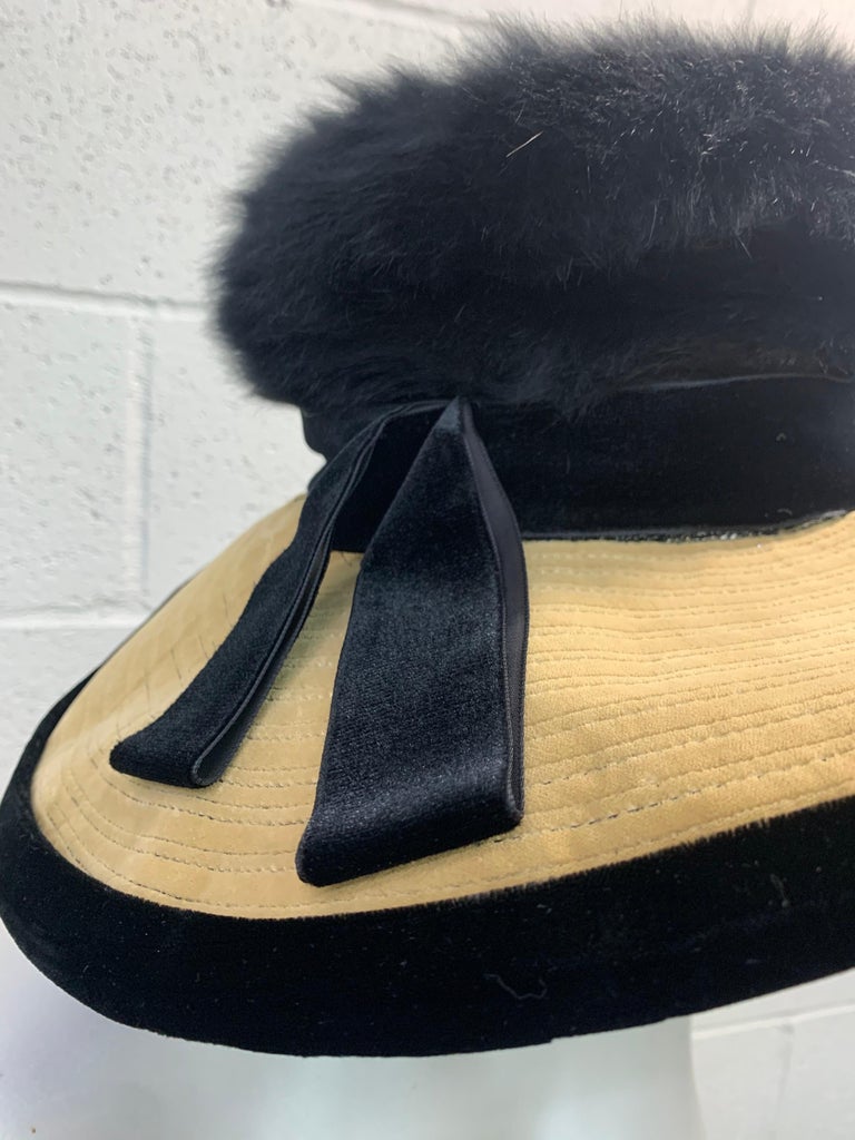 A stunning 1960s Doris portrait hat in black & ecru velvet. Brim is wide at front/sides and curves in at back. Tall crown with angora fur felt. Size Small-Medium. 
