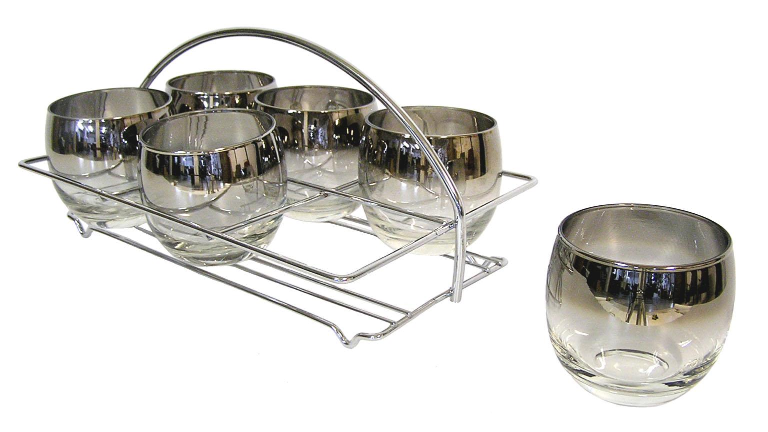 A set of six Dorothy Thorpe silver fade 10 ounce roly poly glasses from the 1960s Mid-Century Modern era. Set is decorated along the upper half in a faded silver tint and comes in it's original chromed steel carrier. Overall excellent condition.