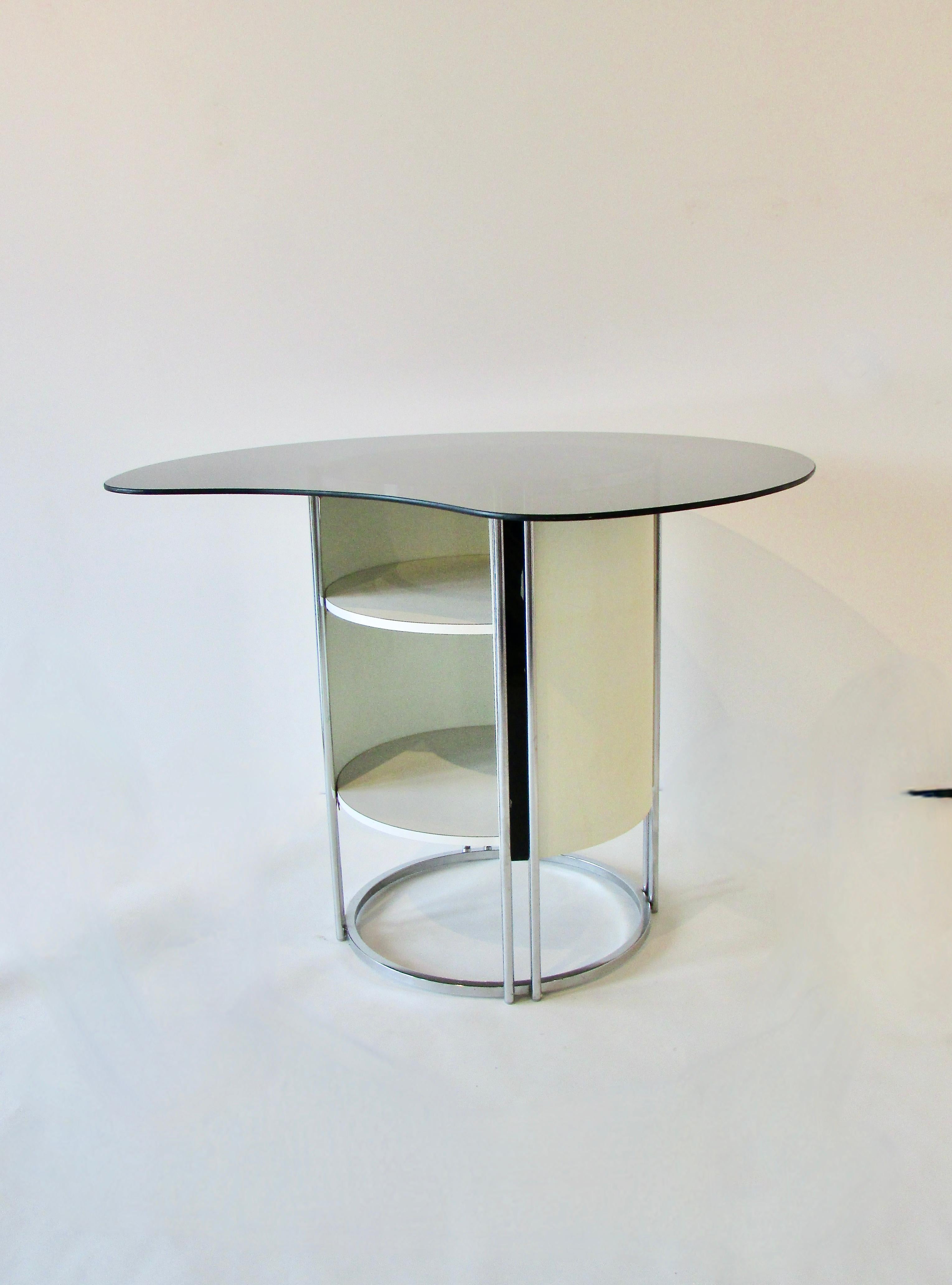 1960s dry bar with four bar stools . Bio-morphic shaped smoked glass top rests on chrome frame with cream lacquered panels . Storage area below glass top . Four chrome frame bar stools with smoked acrylic back rest and leather covered seats . Bar