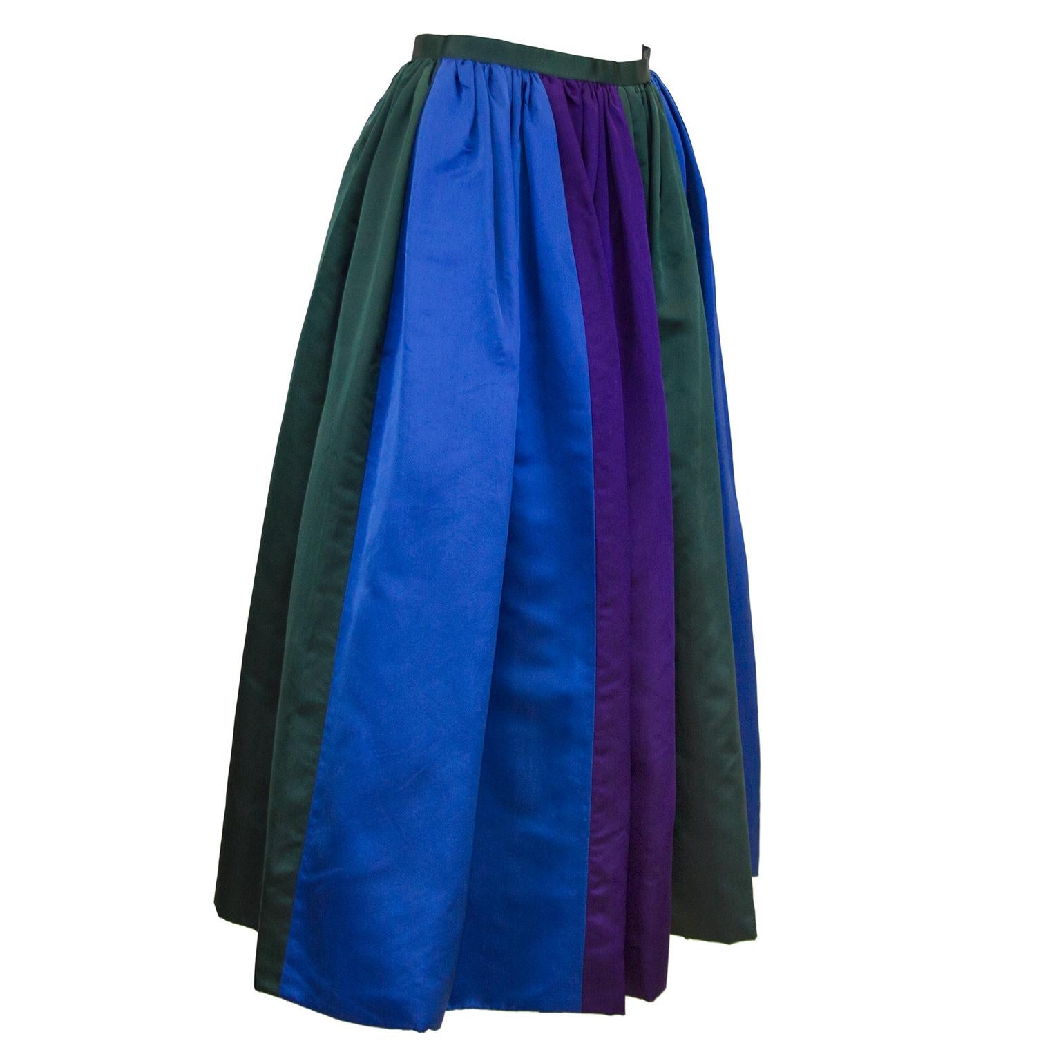 Designer unknown 1960's duchesse satin color block evening skirt in royal blue, hunter green and deep purple. Not quite floor length, fits average height woman lower calf to just above the ankle. In excellent condition, there is a label in the
