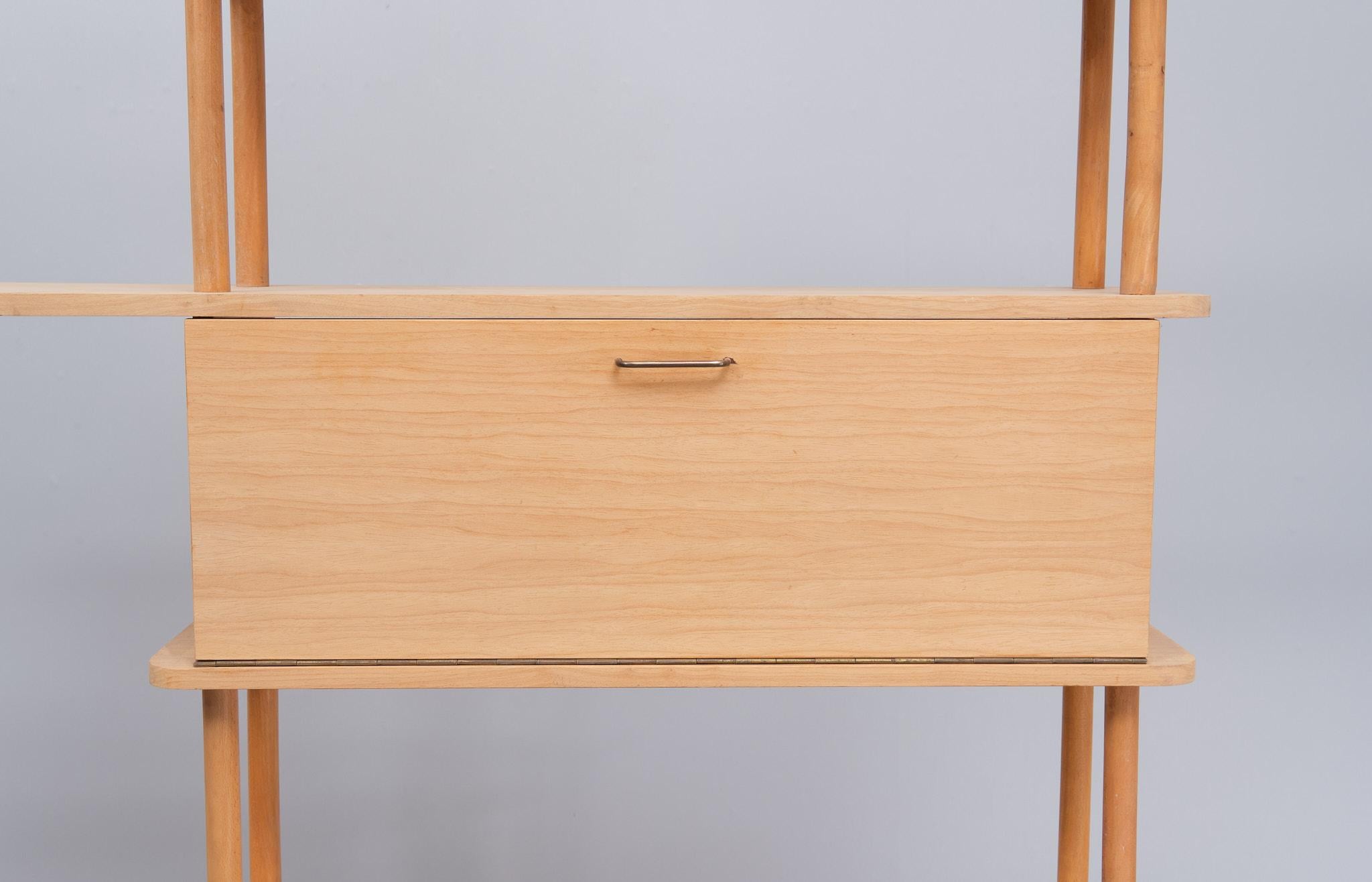 Vintage stick cabinet. A design by Willem Lutjens for Den Boer Gouda, the Netherlands, 1960s. The Beechwood shelves are pure ,so no lacker or wax .
Beechwood cabinet with clean lines, can be used as a bookcase against the wall, but also suitable as