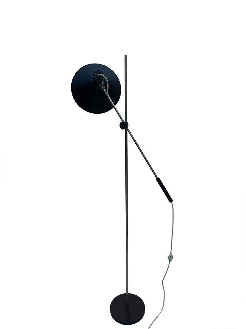 1960s Dutch floor lamp by J.J.M. Hoogervorst for Anvia

A Dutch floor lamp designed by J.J.M. Hoogervorst (Alkmaar 1918-1982) for Anvia, during the 1960s. 
An adjustable floor lamp in height and width, in the middle with a rotary knob for