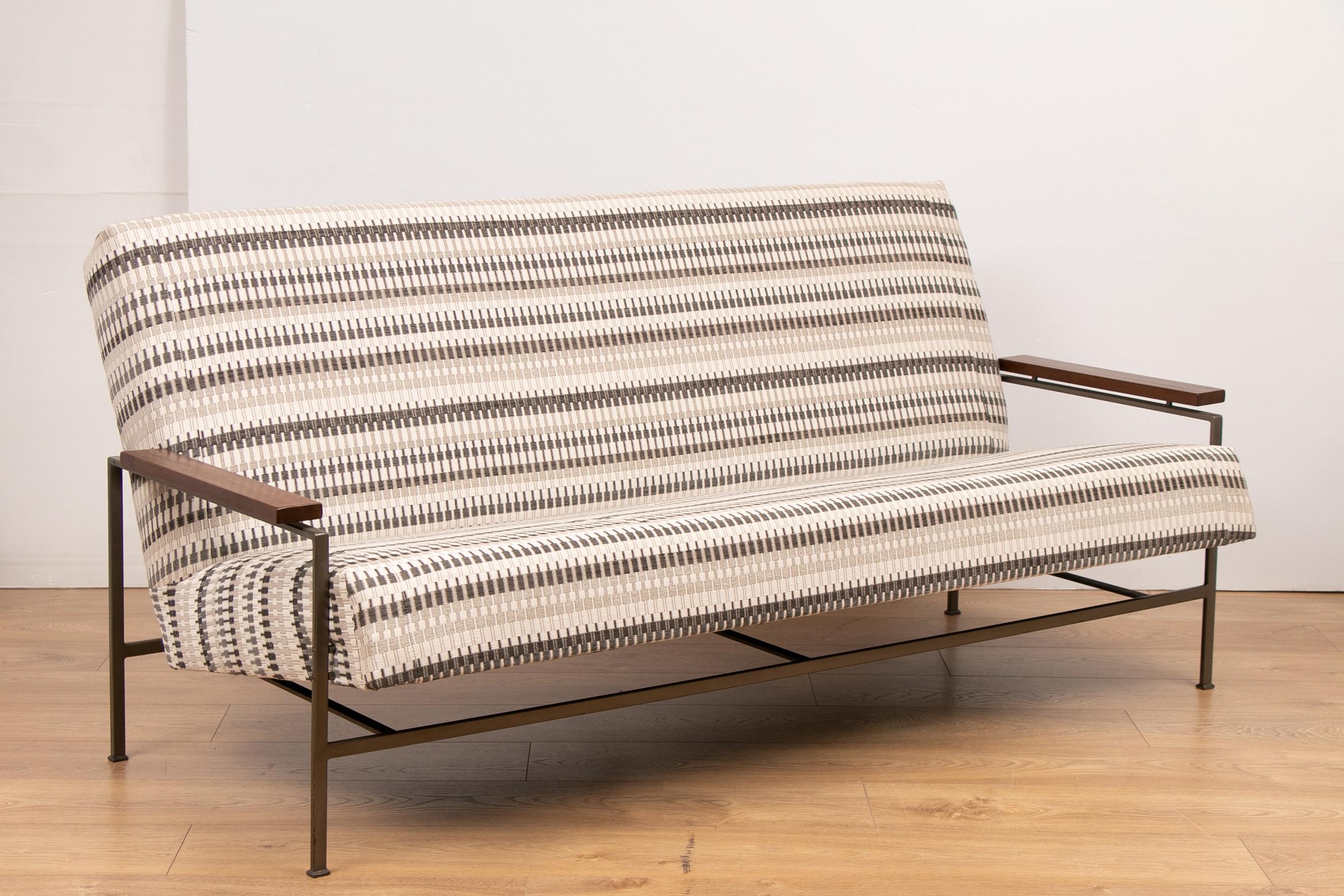 1960s, midcentury, Minimalist, modern, designed sofa, with two armchairs and matching coffee table designed by Rob Parry and manufactured for Gelderland in the Netherlands.

This is an early design named “Lotus” with a metallic grey steel frame