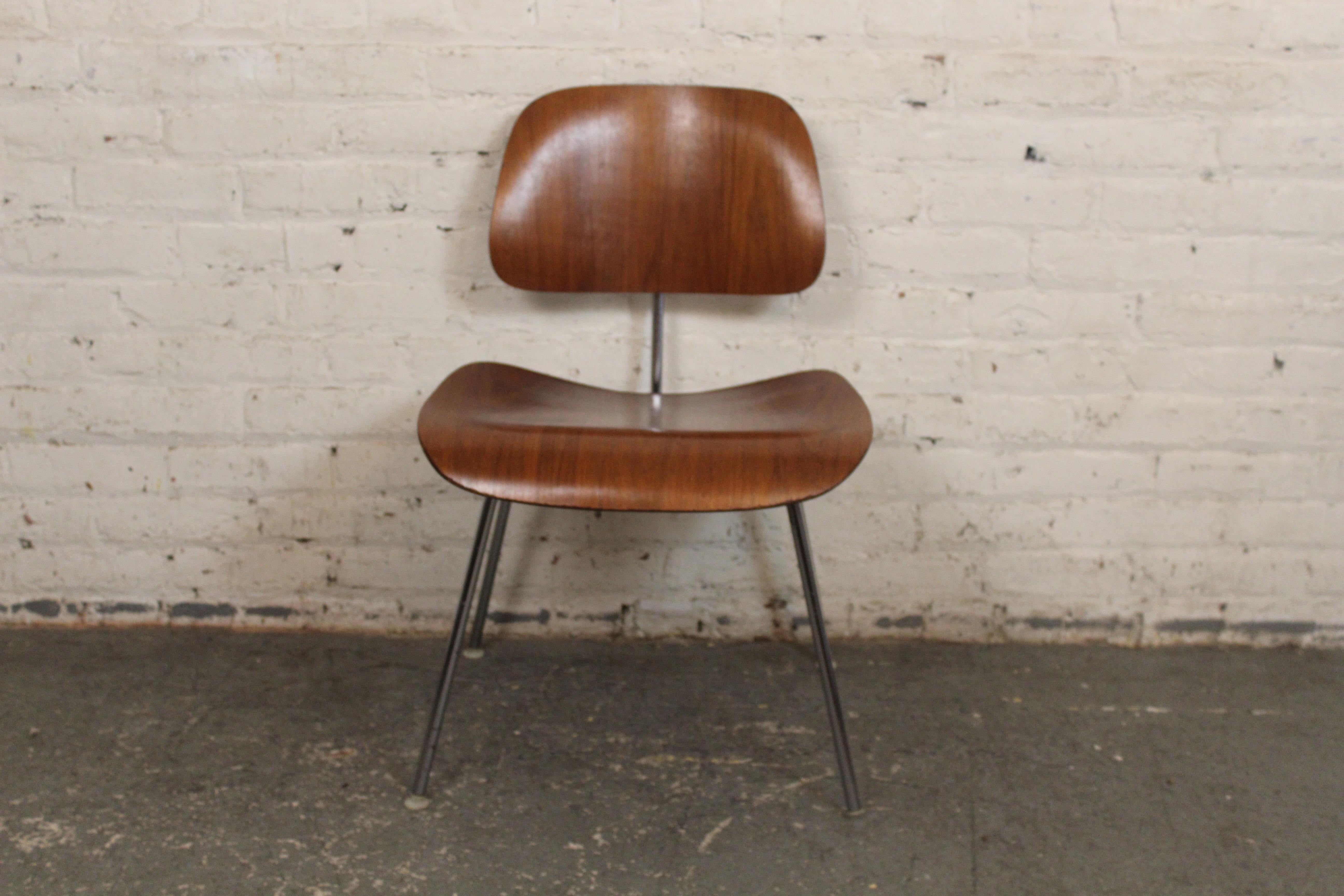 The iconic mid-century modern DCM chair designed by Herman Miller for the Eames company is a standout of 1960s design. Simple designs with two bentwood pieces making the seat and back, set on a strong metal frame. This chair is durable, functional,
