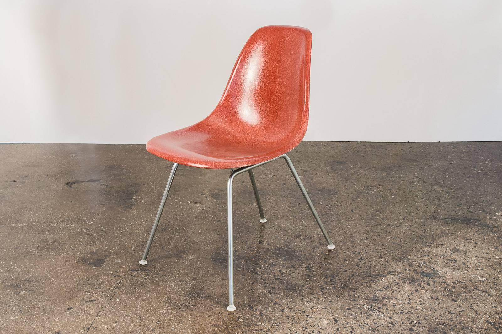 Original 1960s Eames terracotta fiberglass shell chairs with original H bases, designed by Charles and Ray Eames for Herman Miller. The scarce terracotta shell has its original finish with distinct thread texture. Narrow mount. Shown here mounted on