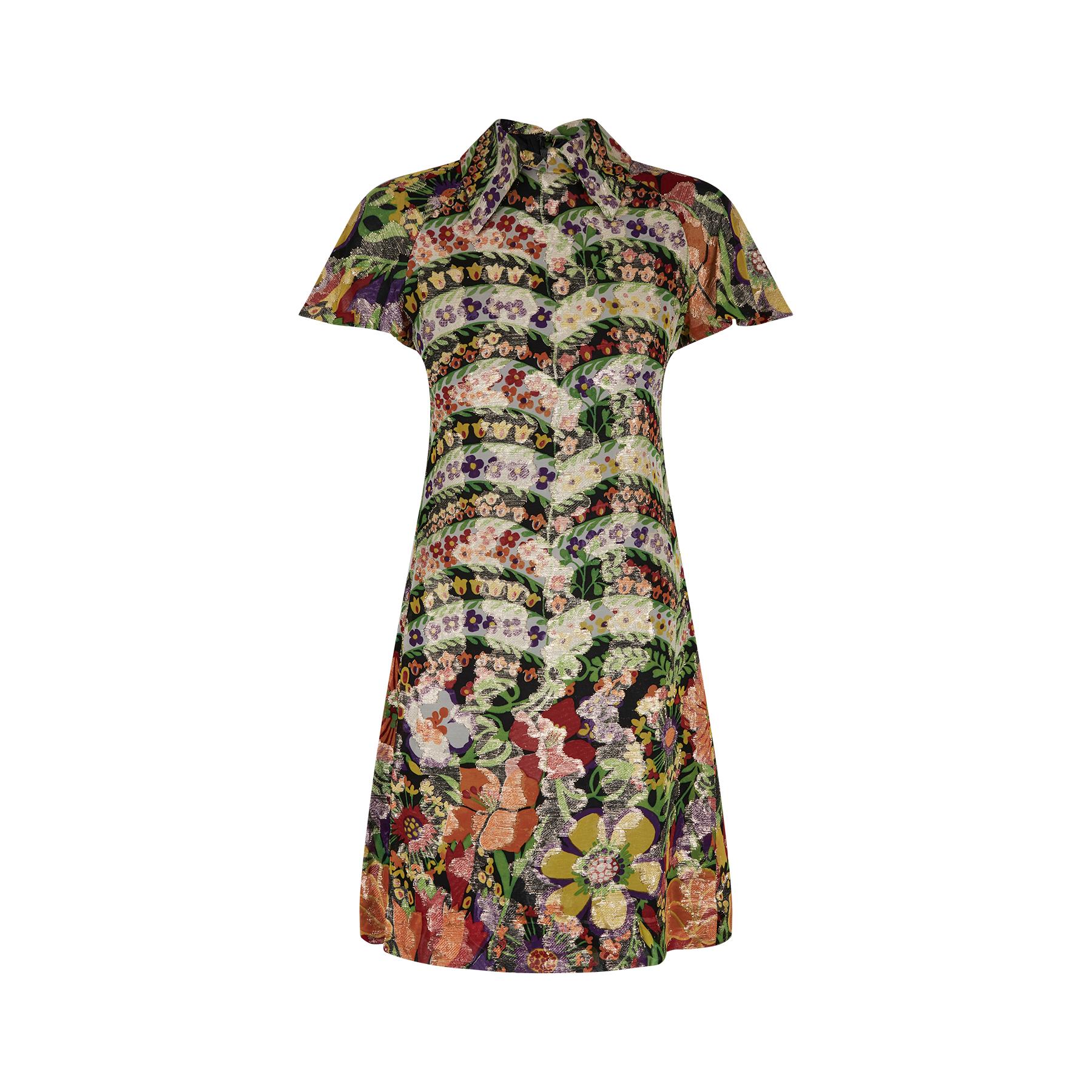 Late 1960s or early 1970s couture made floral lame dress. The print is exceptional and by American designer Rodriguez - its very similar to the work Oscar de la Renta was doing around this time. His clothing line was sold in high end department