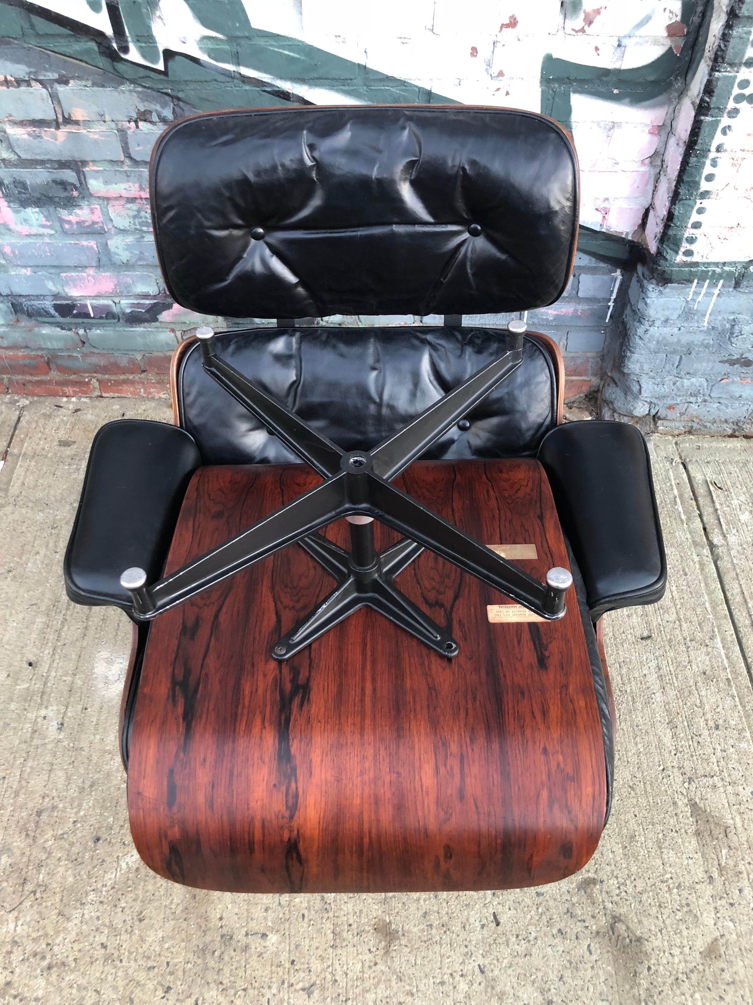 Gorgeous Herman Miller Eames lounge chair and ottoman. Original signed pair. All down and feather cushions dates this to the early 1960s. Extremely comfortable. Wood has been oiled and leather cleaned and conditioned. Black leather in very good