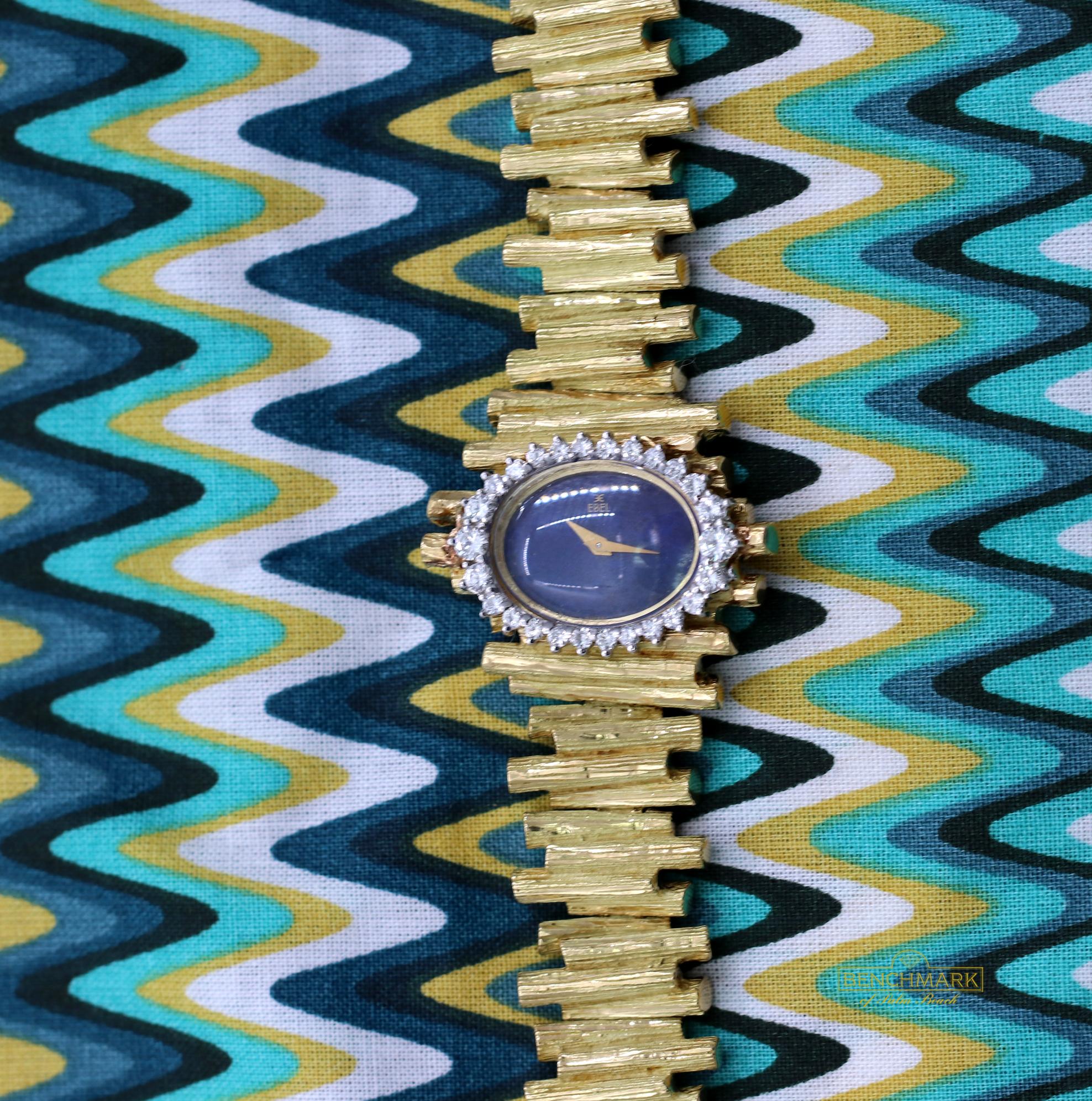 This is an excellent example of 1960's design borrowing inspiration from nature.
The dial is cut from rich blue Lapis-Lazuli, and is surrounded by twenty six round brilliant cut diamonds weighing 0.75 carat, total approximate weight. The bracelet is