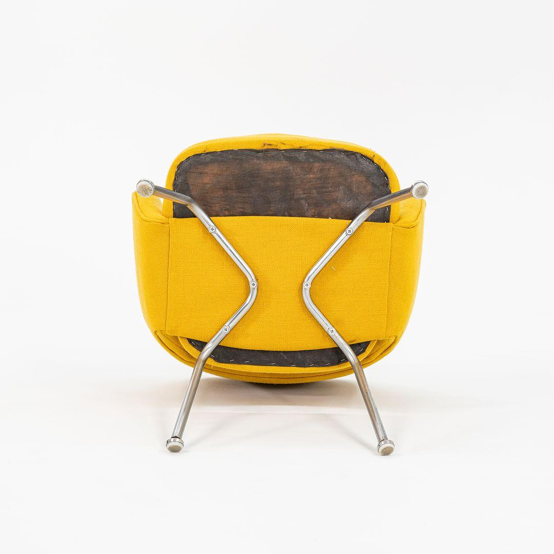 This is a Saarinen Executive Desk Chair, Model 71A, originally designed by Eero Saarinen for Knoll in 1950. This example dates to the 1960s. It features legs of polished tubular stainless steel, and has an upholstered seat and back. This piece