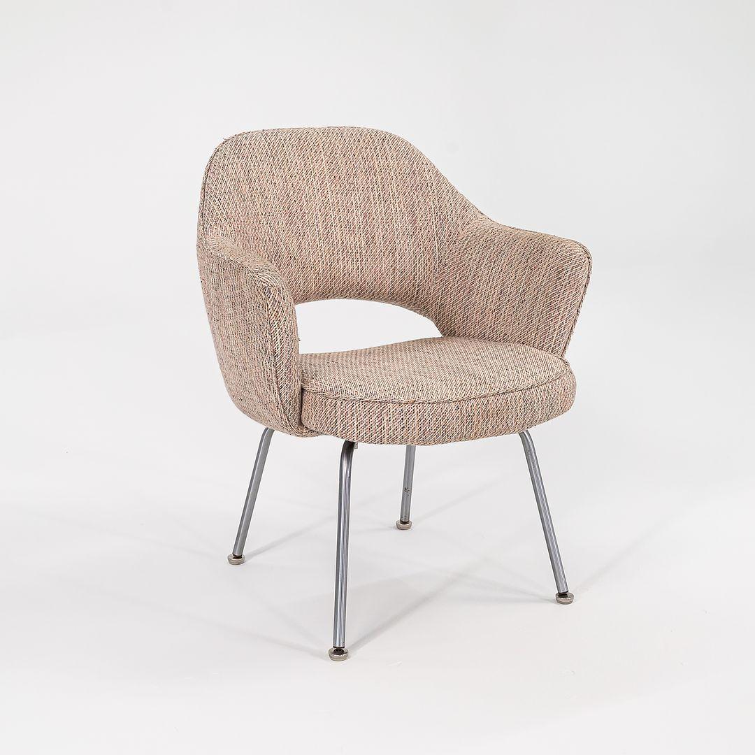 This is a Saarinen Executive Chair, Model 71 USB, designed by Eero Saarinen for Knoll in 1950. This particular example dates to the 1960s. Its design features legs of polished tubular stainless steel, and has an upholstered seat and back. It is