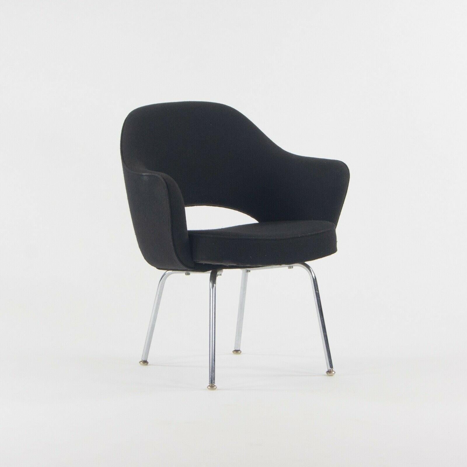 Listed for sale is an Executive Armchair with tubular legs designed by Eero Saarinen and produced by Knoll. This chair was at one point in its life professionally reupholstered in a black hopsack-like fabric. The upholstery was done very nicely. It
