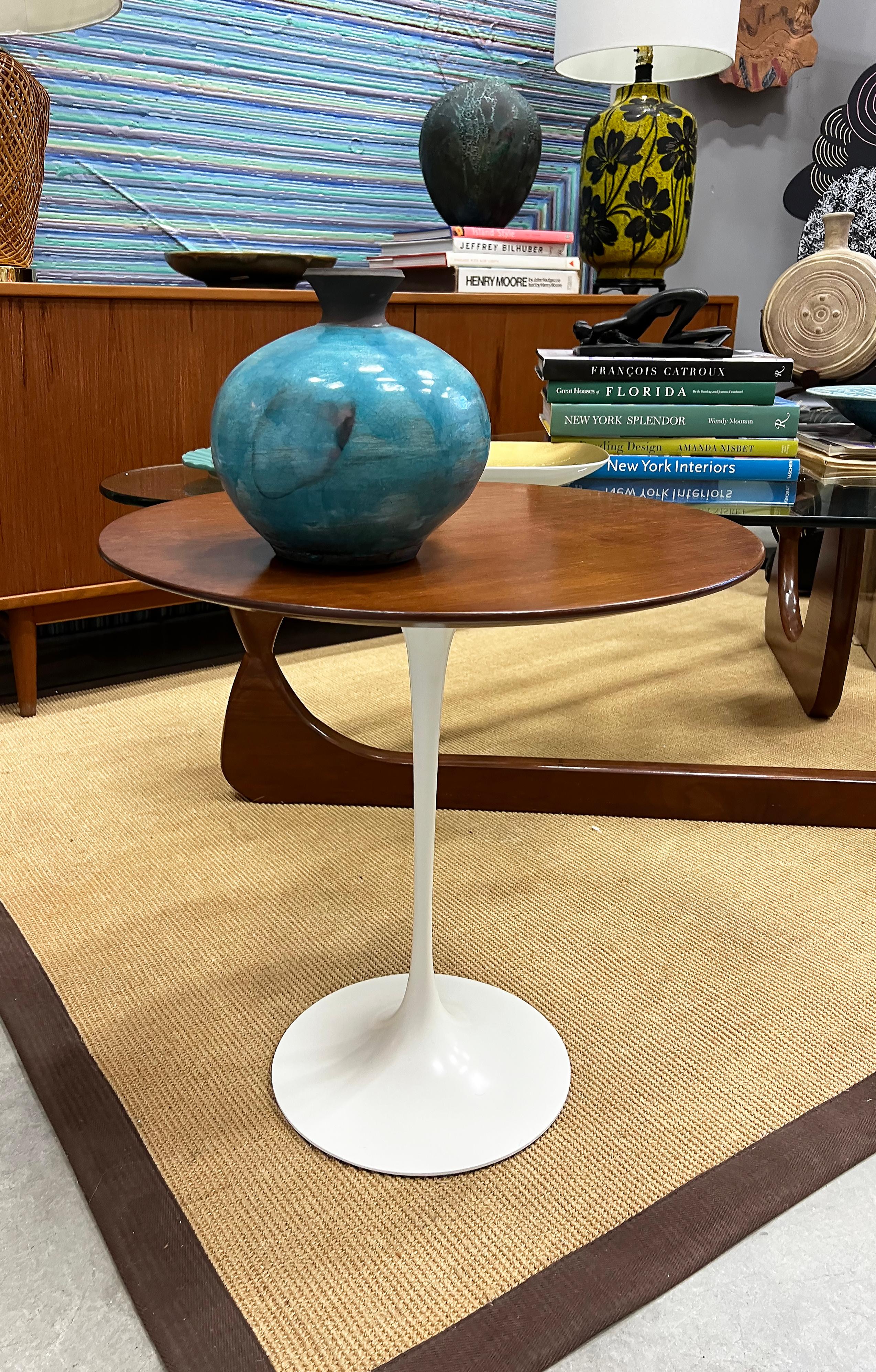 1960s Eero Saarinen Walnut Tulip Side Table,  Label,  Refinished

Offered for sale is an original Eero Saarinen tulip side table from Knoll. This Midcentury Modern classic has a beautiful walnut top that has been refinished and is supported by a