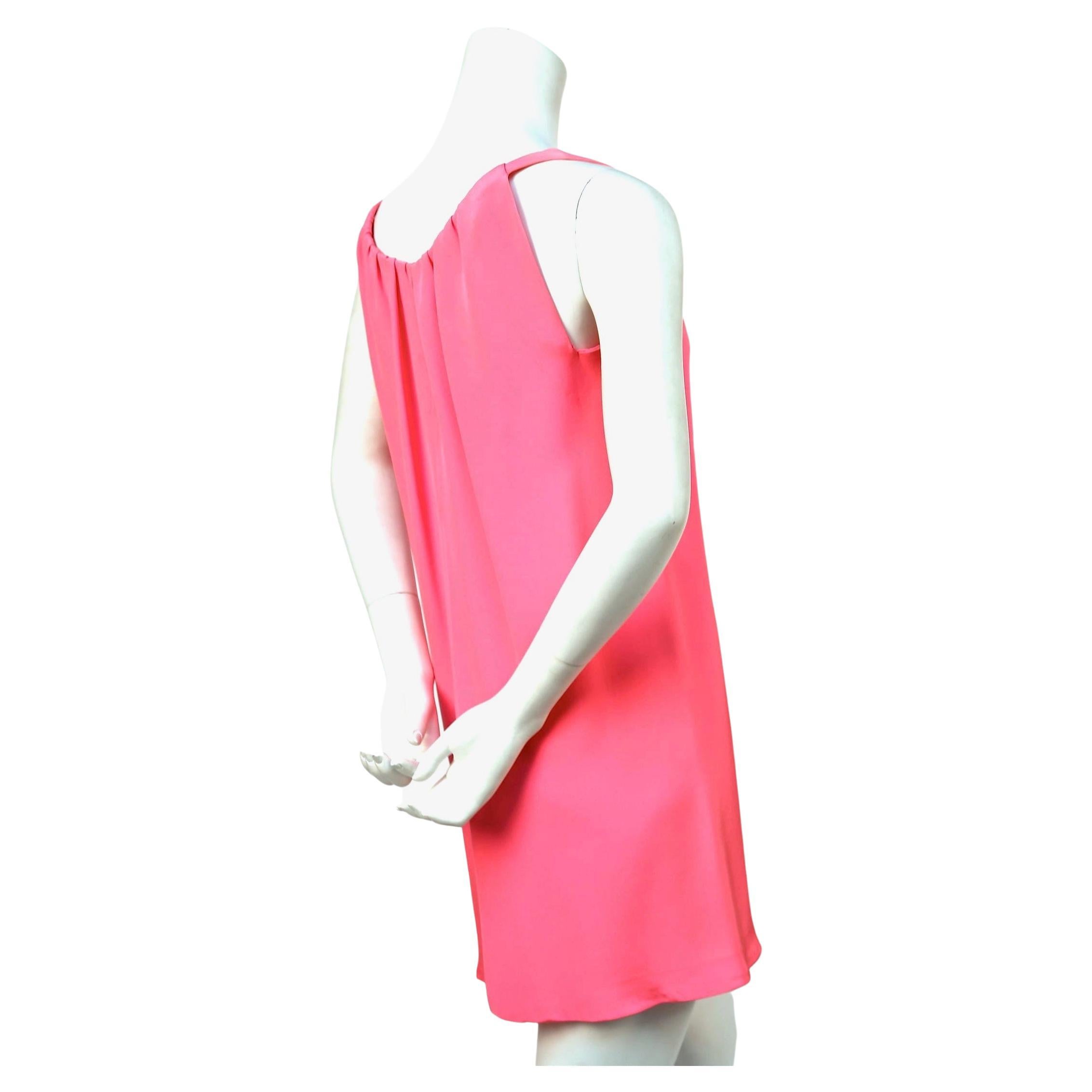 Very rare, vivid fuchsia, silk mini dress by Cristobal Balenciaga for Eisa dating to the 1960's. Fits a size 4 or 6. Approximate measurements: bust 36