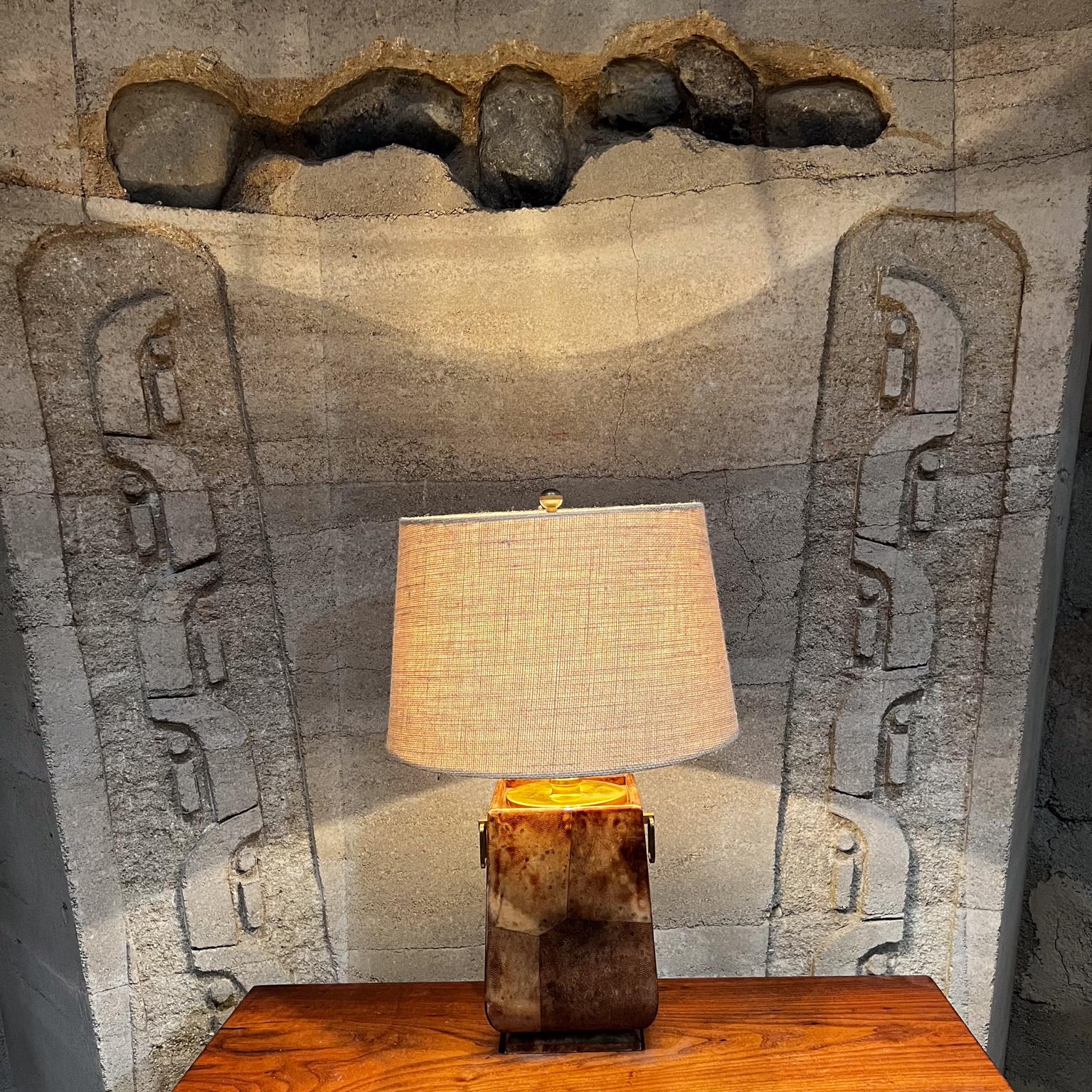 1960s Aldo Tura Lacquered Parchment Bronze Table Lamp Italy 
Elegant Brass Rings on each side.
Designer Aldo Tura, known as the master of parchment. 
Label present.
15.75 h x 7 x 7 w
Original Unrestored Vintage Condition. No shade is included.
Wear