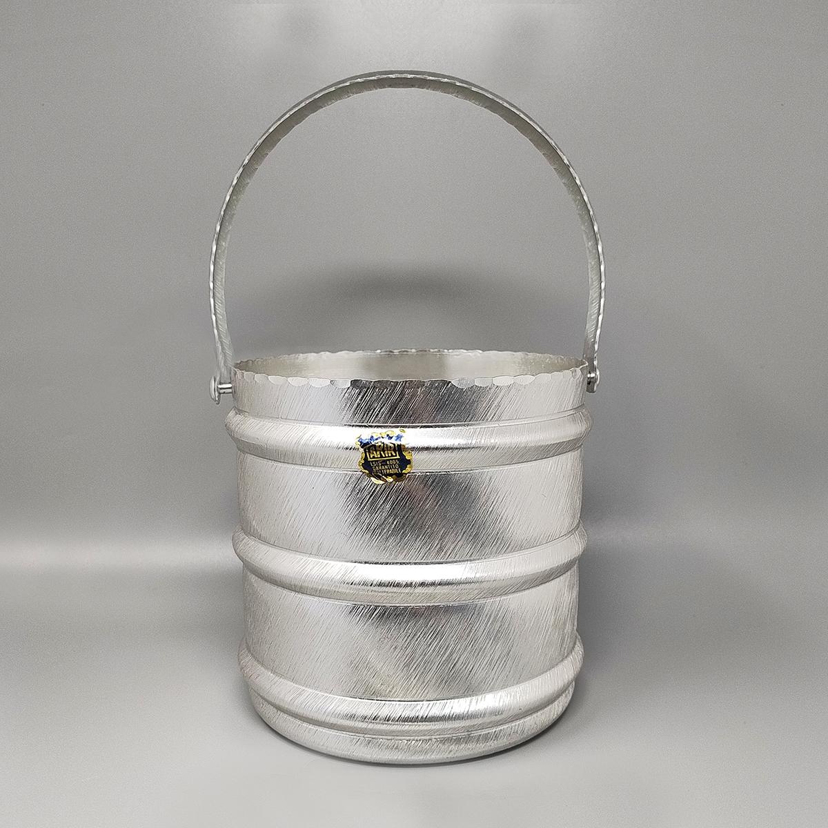 1960s Elegant champagne ice bucket by Arir in aluminium. Made in Italy. The item is in excellent condition and it's signed at the bottom.
Dimension:
Ice bucket
diameter 7,08 x 7,48 H inches without handles
diameter cm 18 x cm 19 H without