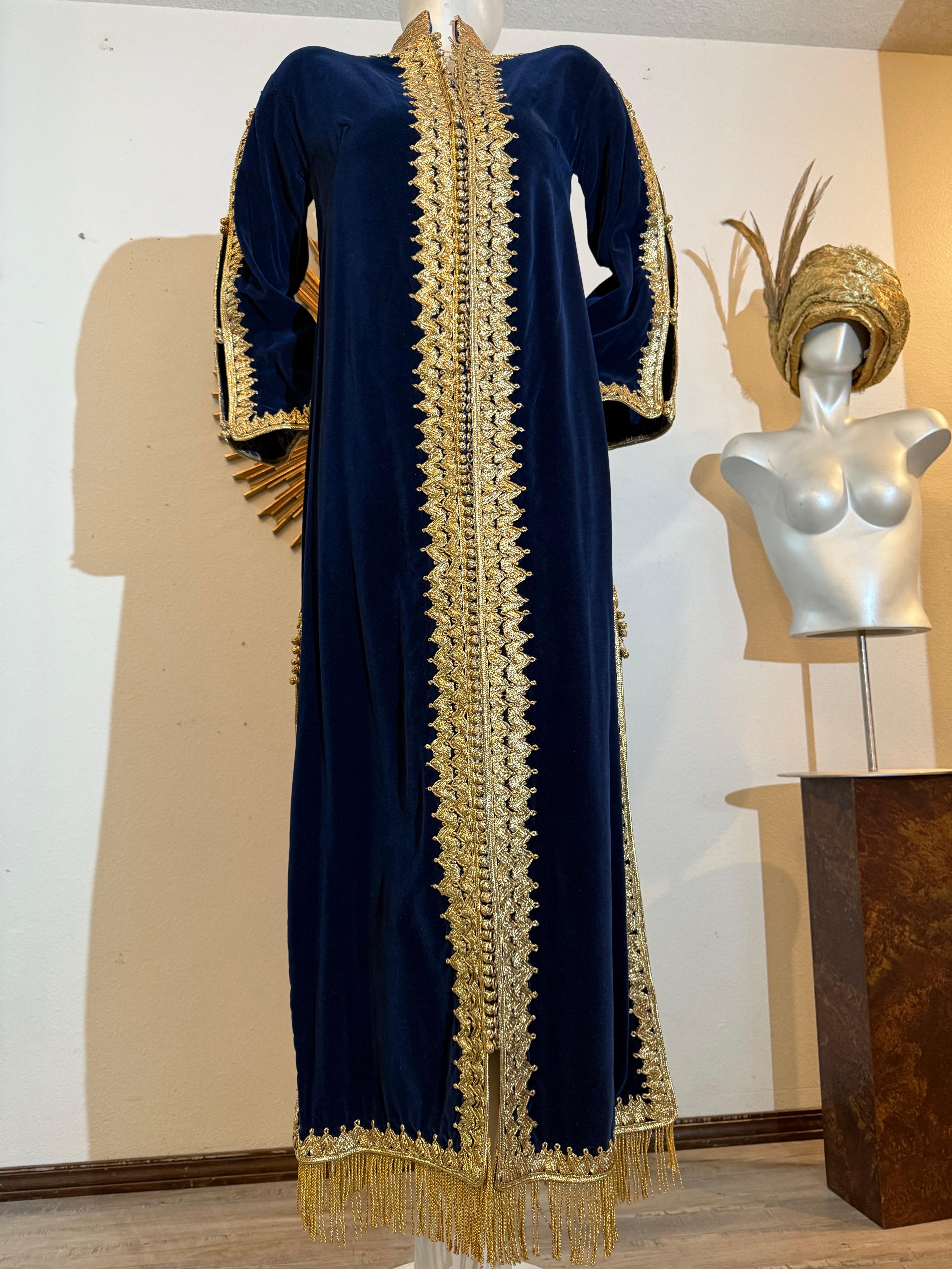 1960s Elegant Moroccan Sapphire Blue Velvet Caftan w Gorgeous Gold Braidwork :  A fantastic traditional Moroccan style caftan in an intriguing deep blue velvet with heavy gold braidwork trimming collar, center front placket and down the sleeves, as