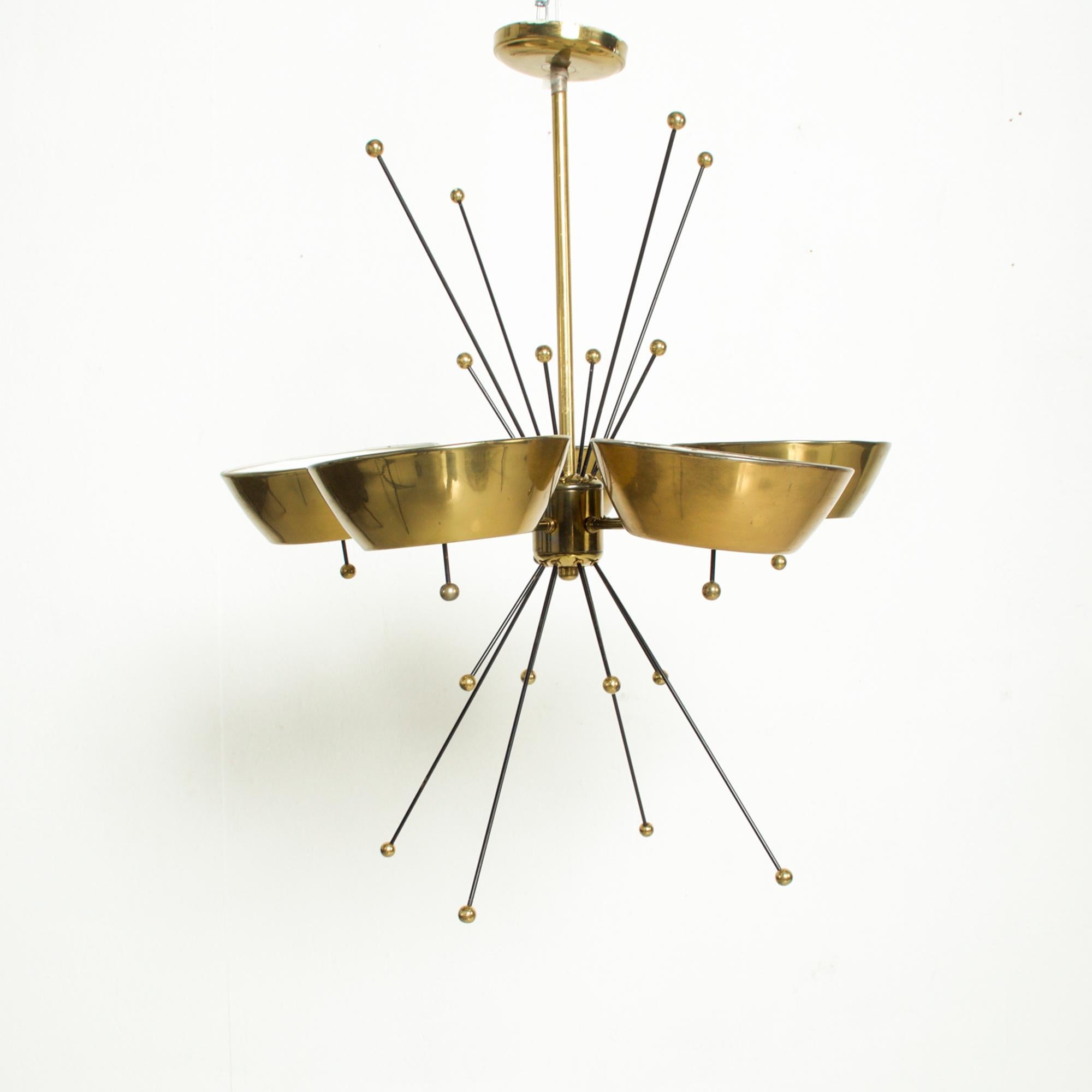 Sputnik chandelier made in Italy circa 1960s. Crafted in cupped brass, glass and iron rods. 
Unmarked, attributed to style of Finnish designer Paavo Tynell. 
Dimensions: 29.5 height x 23.5 inches diameter.
Very good vintage condition. Light wear