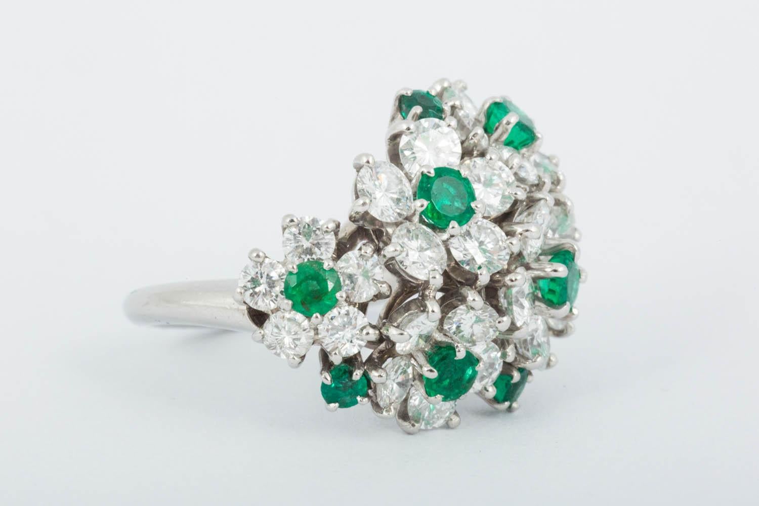 Finely cut Natural emerald and Diamond flower ring set in Platinum Circa 1960
Finger size M