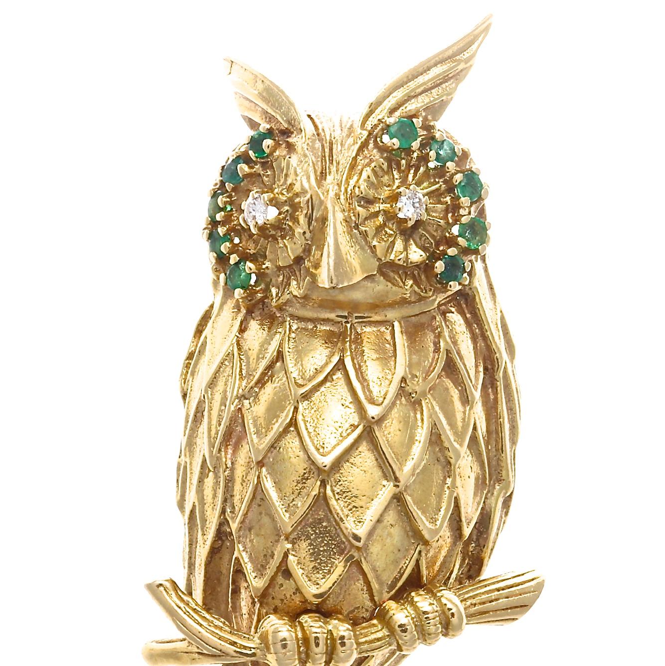 The fun and flair of the 1960's produced some of the most bold and whimsical jewelry. 
This beautifully detailed 14k yellow gold owl brooch is adorned with approximately 0.50 carats of emeralds, approximately 0.10 carats of diamonds with G-H color,
