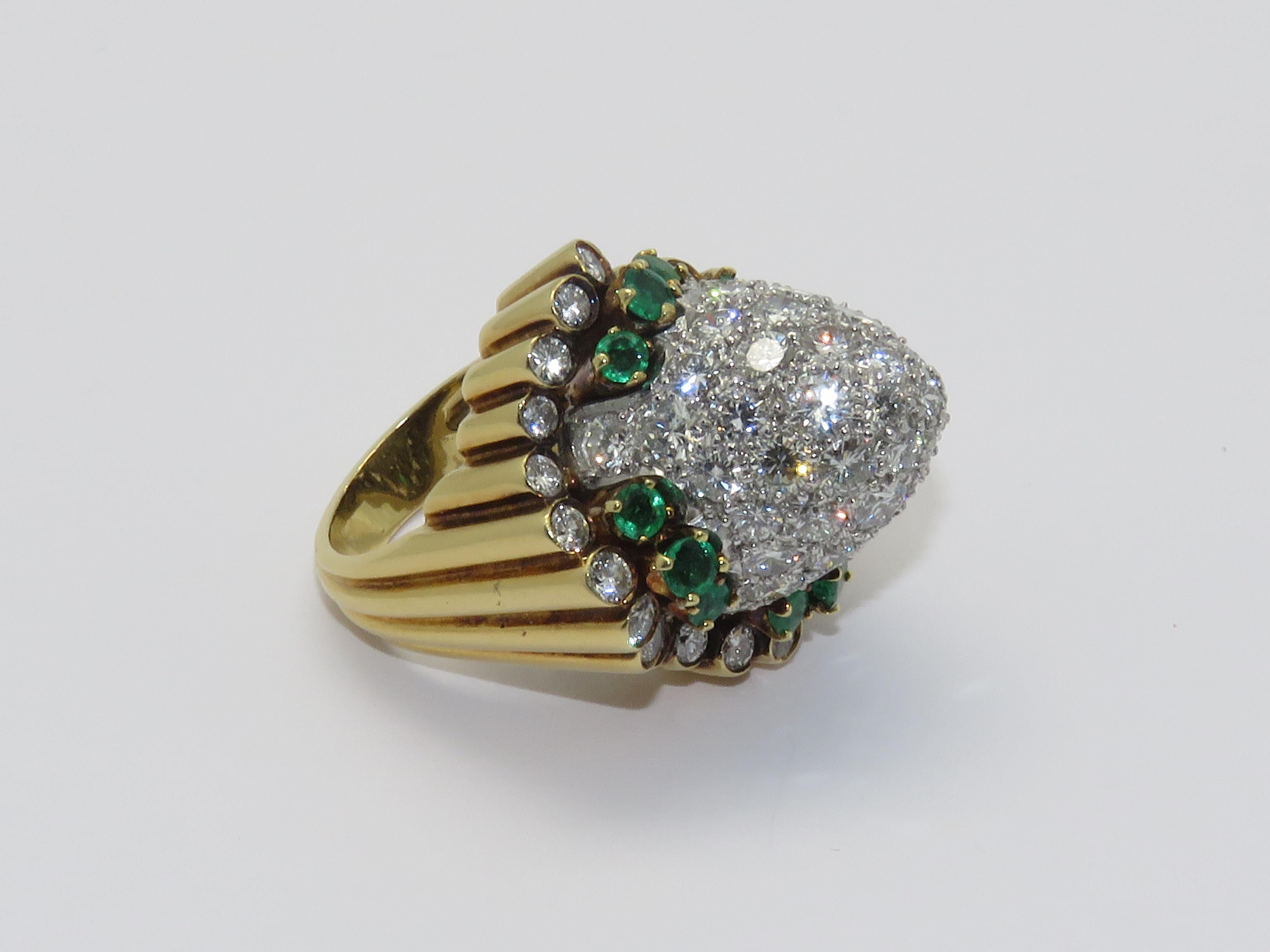  1960 s Beautiful Ring.
A diamond , emerald , 18k yellow gold and platinum ring.
French Marks
Diamond: 7 cts Approximately
Emerald: 1.50 ct Approximately

Ring size: 52     6 US
Measurements
Height: 1.57 in ( 4 cm )    Lenght: 1.10 in ( 2.80 cm )  