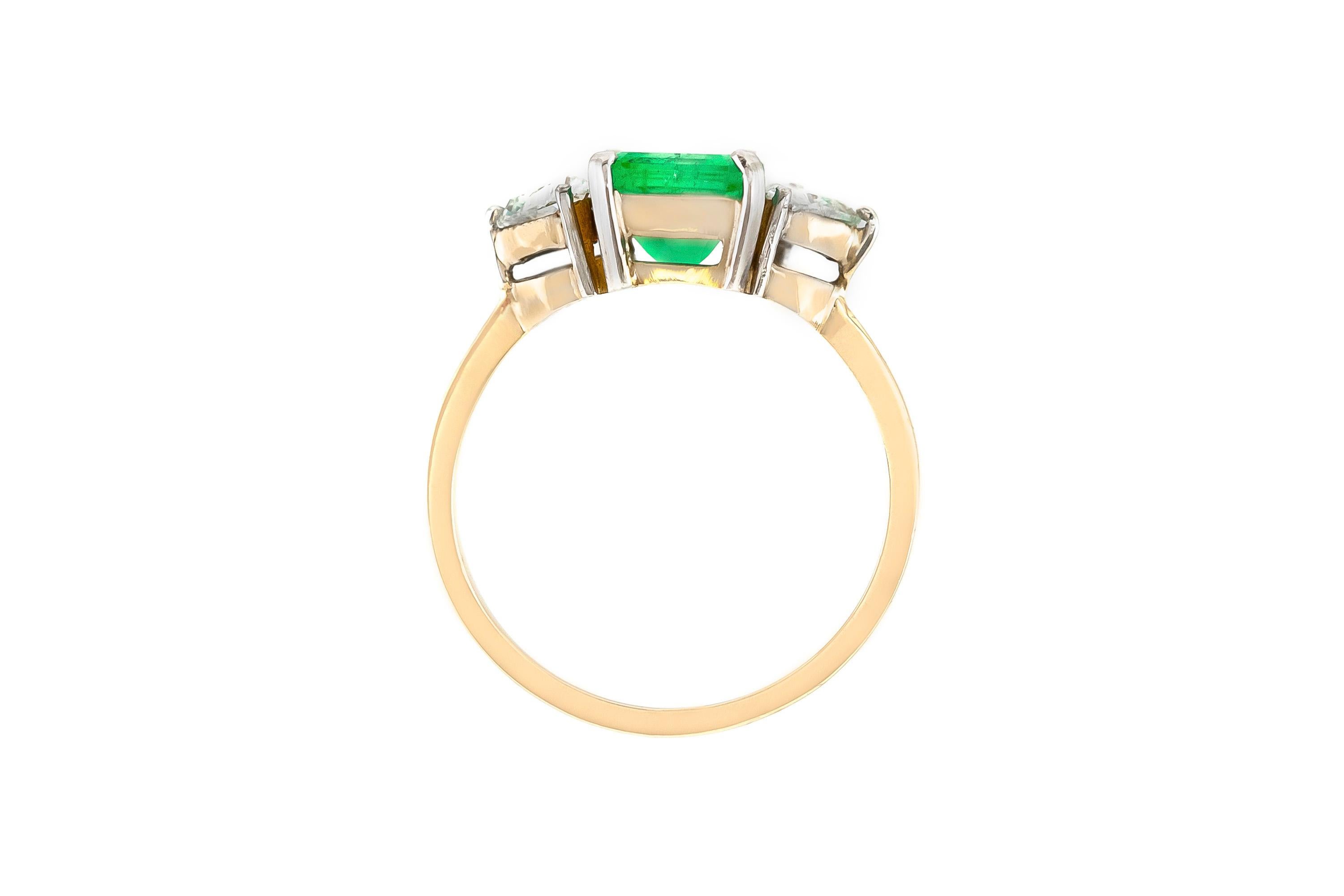 The ring is finely crafted in 18k yellow gold with two heart shape diamonds weighing approximately total of 0.70 carat and center emerald cut emerald stone weighing approximately total of 3.00 carat.
Circa 1960.