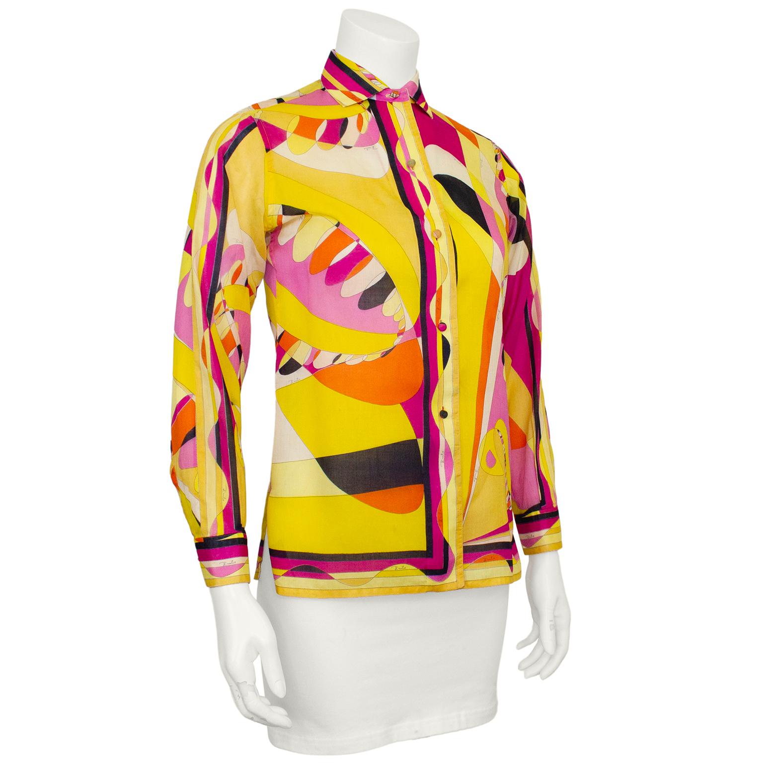 Fabulous cotton Emilio Pucci printed shirt from the 1960s. Made exclusively for Saks Fifth Avenue, the shirt features a black, pink, orange and yellow design. In excellent condition with covered buttons down the front and a stiff collar and placket.