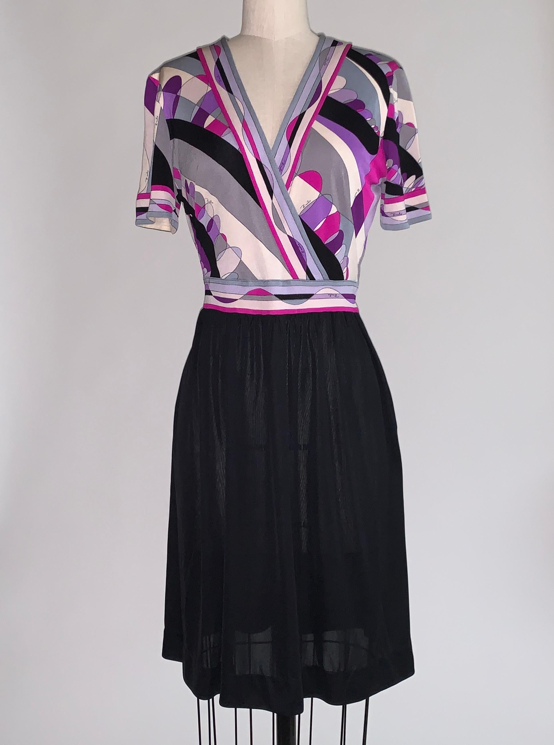 Vintage Pucci 1960s lightweight silk dress with black skirt and Pucci print bodice with short sleeves and v-neck. Grey, cream, purple and fuchsia print signed 