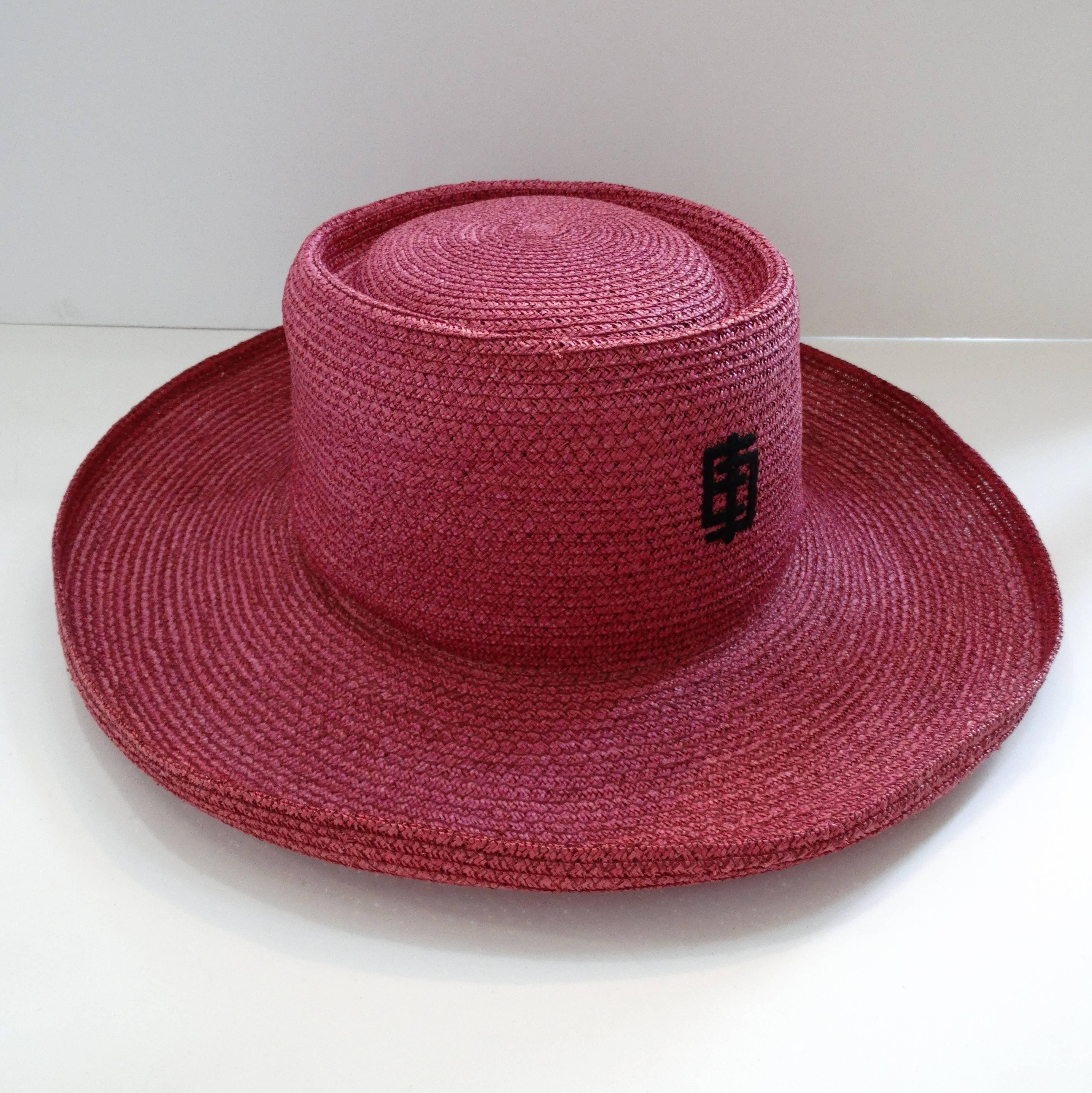 This amazing 1960s hat from designer Emilio Pucci is just the piece you need for resort wear 2018! Made of a woven raffia material, dyed a gorgeous shade of magenta! Boater style silhouette with flocked Emilio emblem on the front. Ribbon band on the