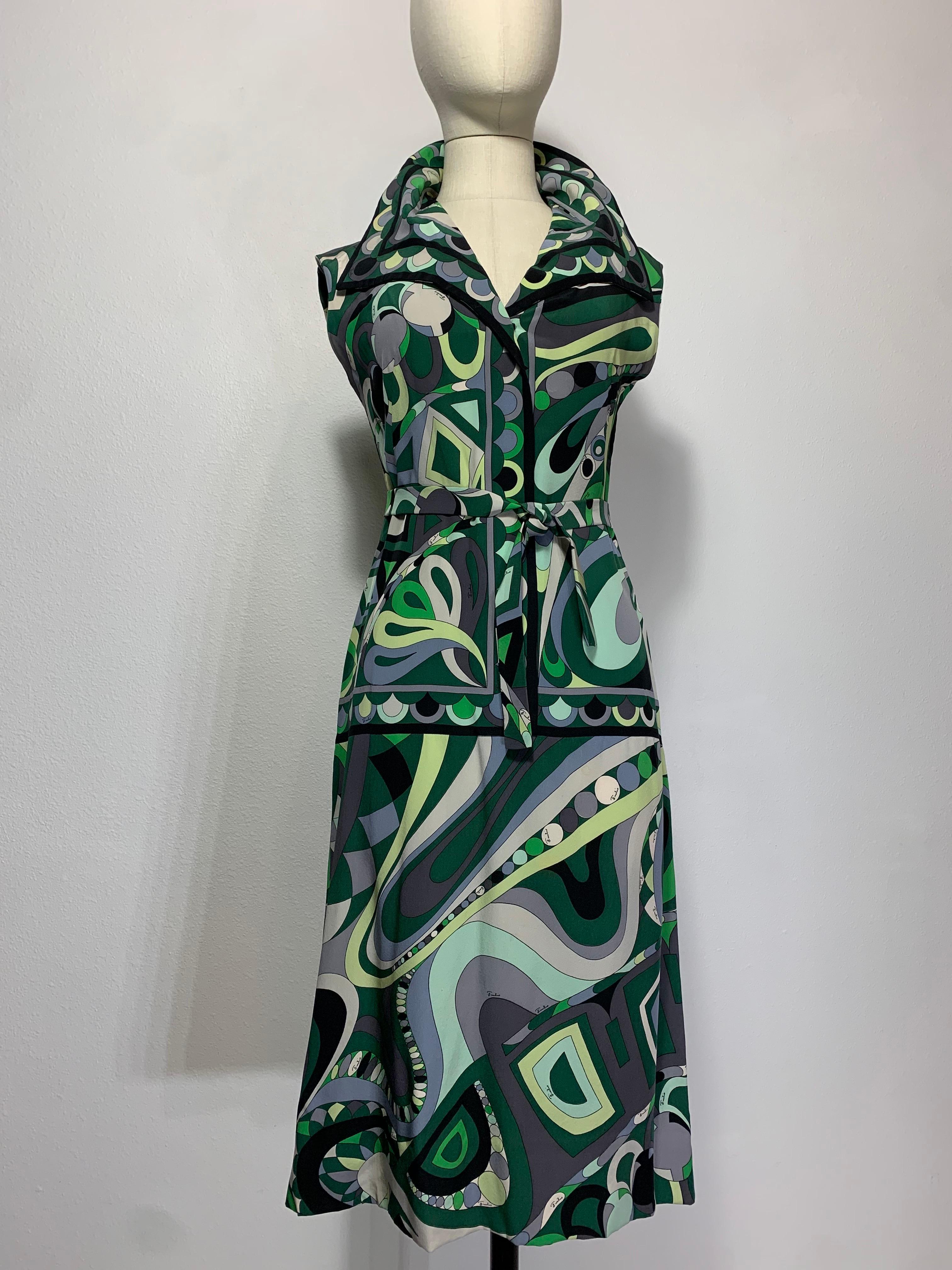 Late 1960s Emilio Pucci Mod Print Silk Day Dress: Iconic Pucci-style psychedelic print in shades of green, black and gray. This sleeveless A-line shift has the appearance of two pieces with a wide spread collar. Original matching tie belt included.