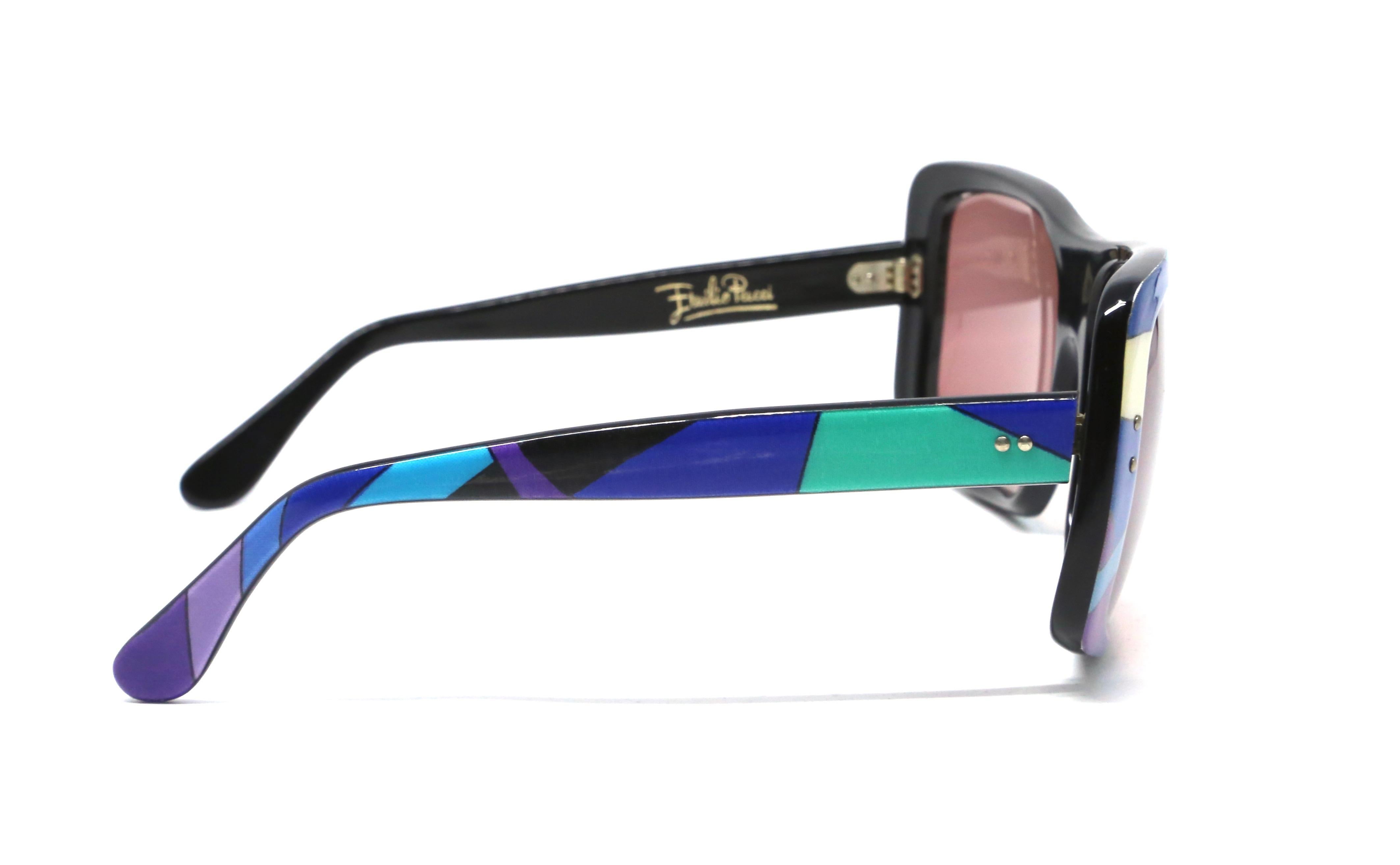 Oversized, laminate printed plastic sunglasses with rose hued lenses from Emilio Pucci dating to the 1960's. Sunglasses measure approximately 6.5
