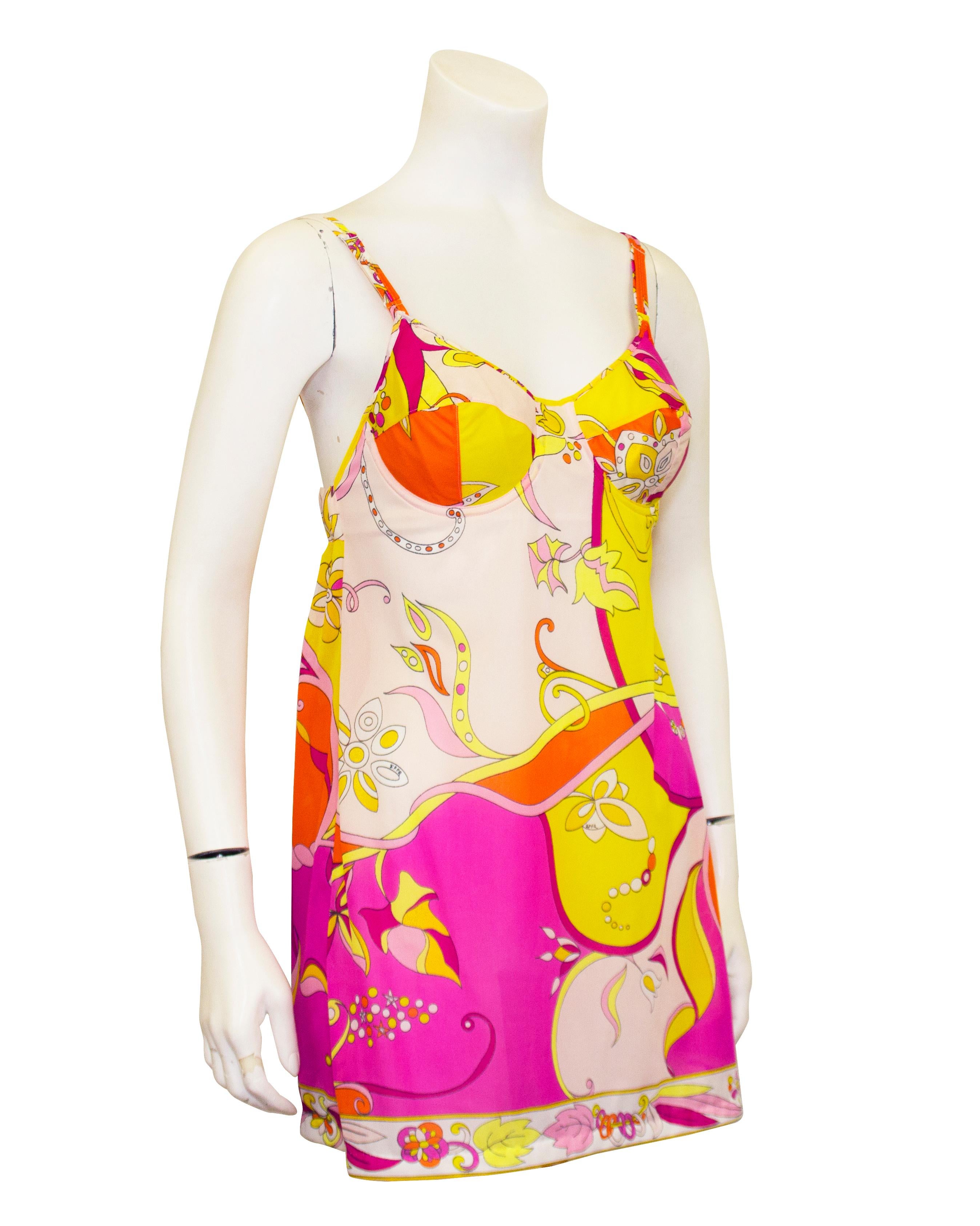 Beautifully vibrant Emilio Pucci for Formfit Rogers baby doll slipdress/negligee from the 1960s. Abstract bright pink, yellow and orange print. Adjustable spaghetti straps with underwire bra bust and empire shape. Elastic back with hook and eye