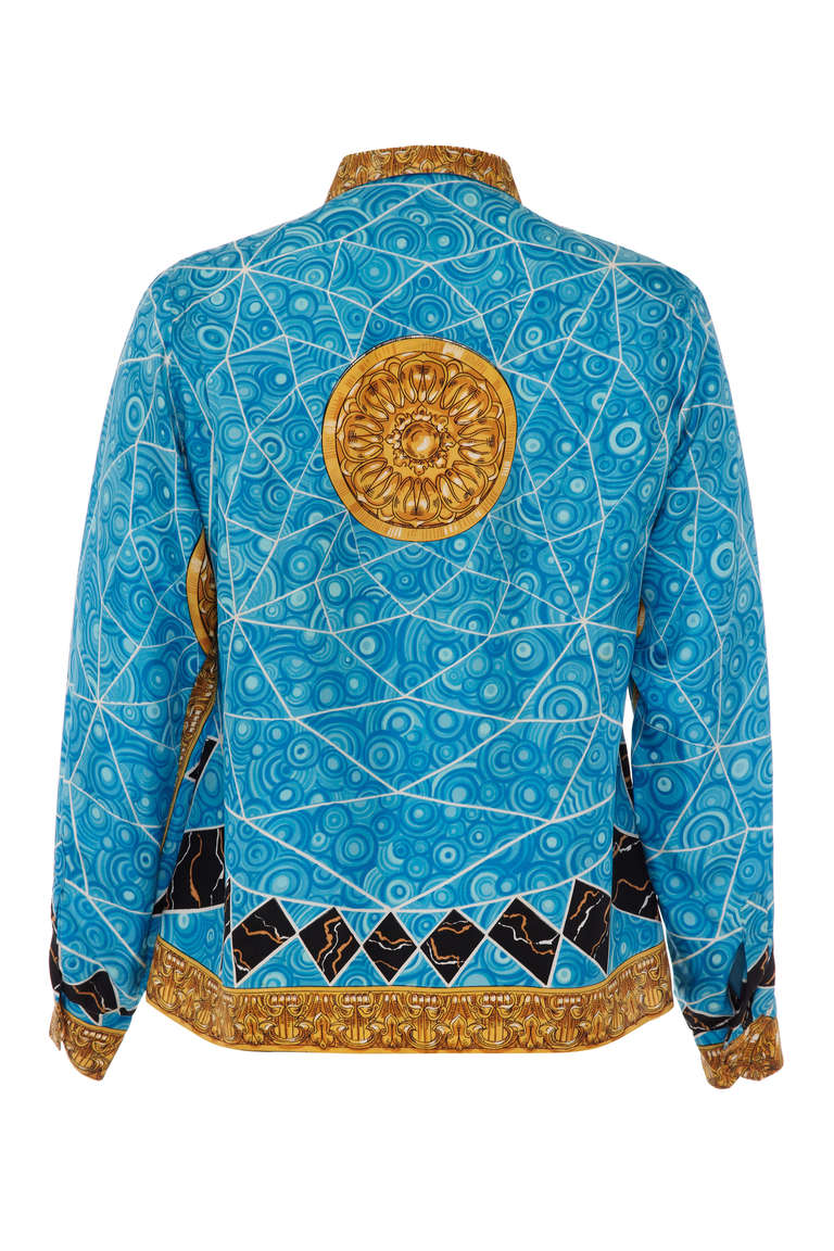 1960’s printed silk shirt from Emilio Pucci, typical of his early style with a blue, gold and black print emulating marble and malachite and very reminiscence of later Gianni Versace designs.  It is fully labelled, has the Emilio signature in the