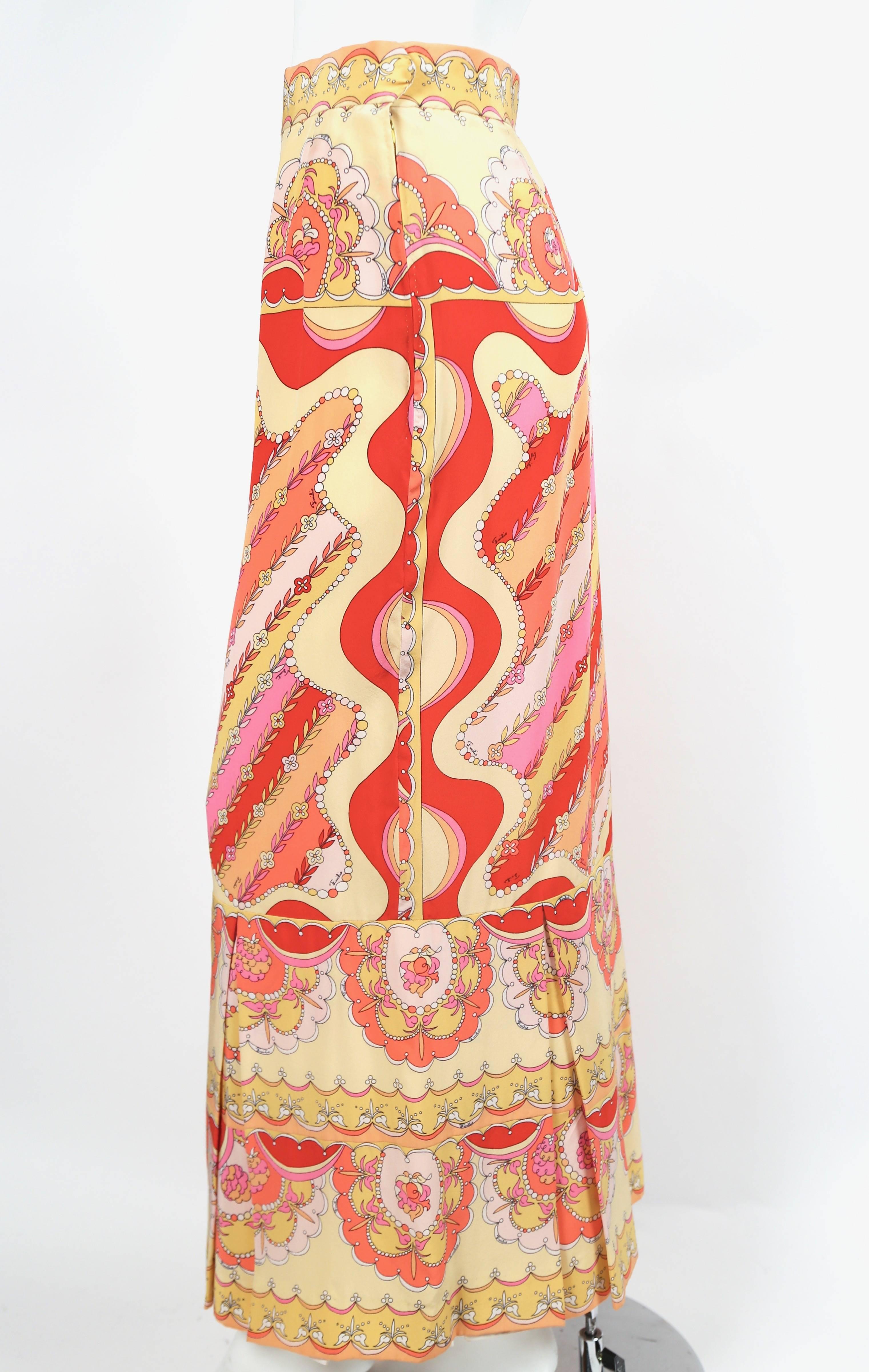 Vividly printed silk skirt with pleated hem designed by Emilio Pucci dating to the late 1960's. No size is indicated however this would best fit a US 6. Approximate measurements: waist 26