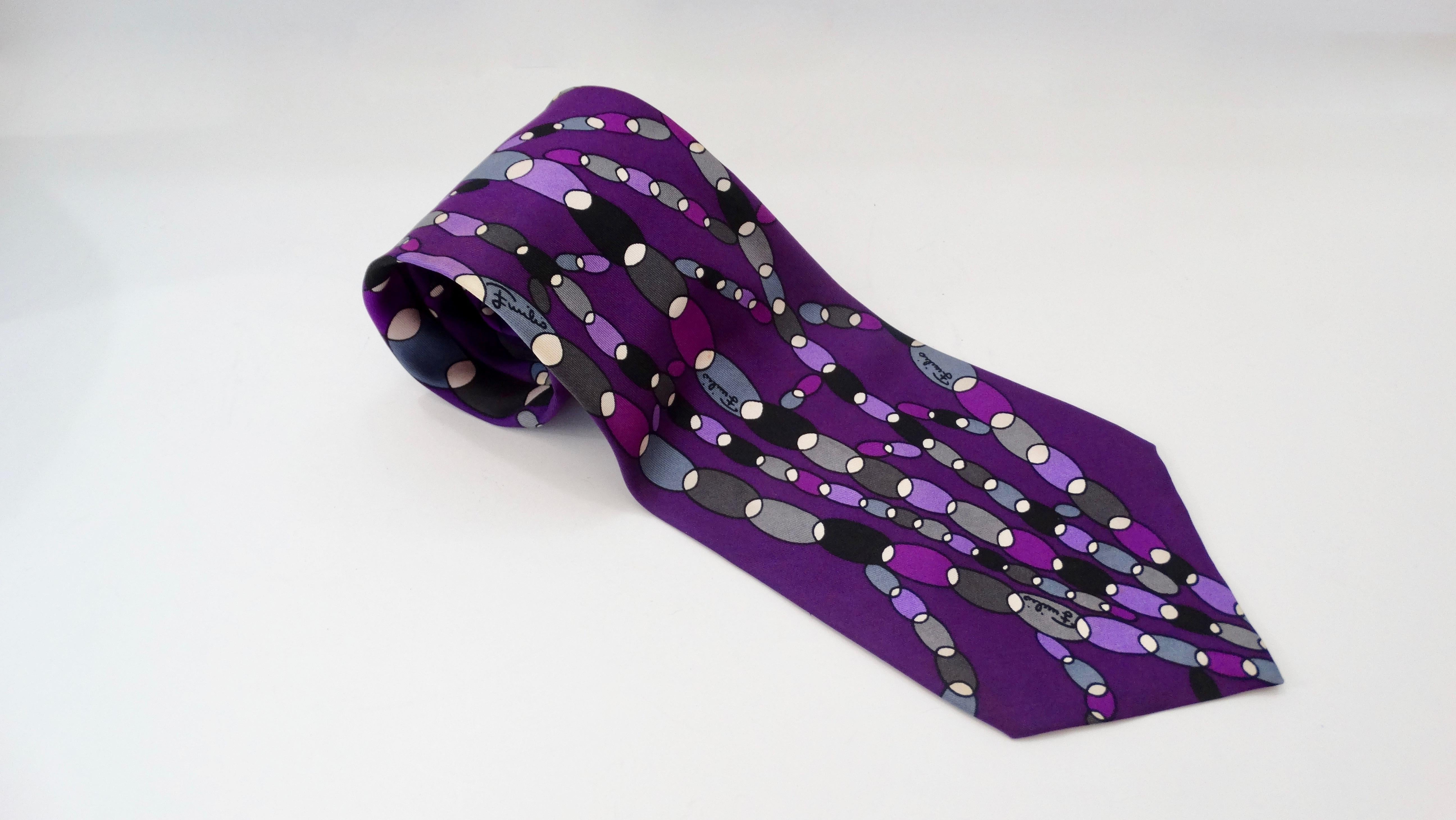 Elevate your look with this amazing Emilio Pucci tie! Circa 1960s, this Silk tie is a rich purple color and features a multi-colored abstract oval print. The perfect vintage piece to add to your wardrobe! Made in Italy for Saks Fifth Avenue. 