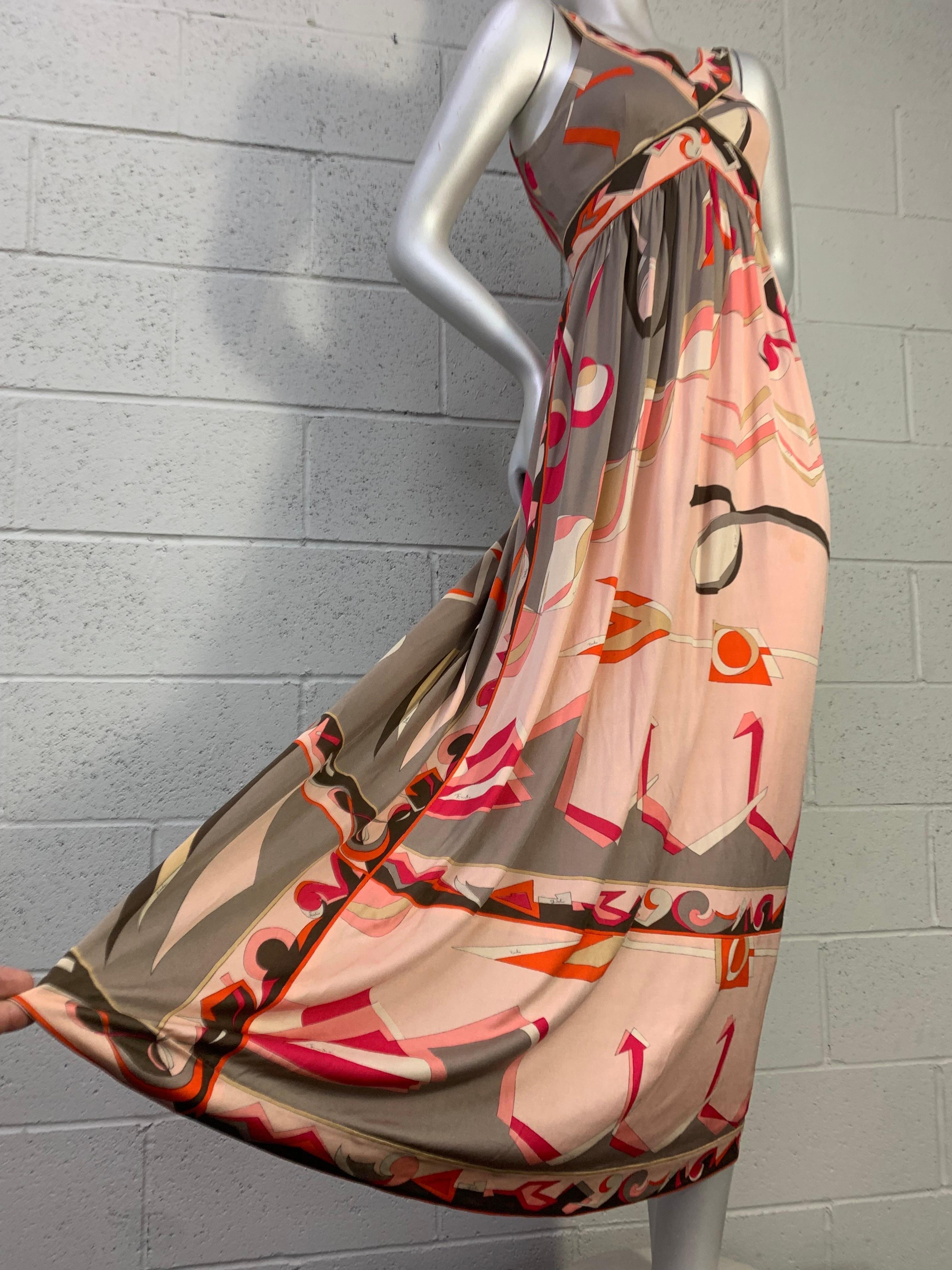 1960s Emilio Pucci Silk Jersey Maxi Dress with Banded, Contoured Bodice in Classic Pucci Print of Arrows and Origami Motifs in Peach, Taupe and Coral. Back zipper, gathered waist, full peach silk muslin lining. US Modern size 8. 
