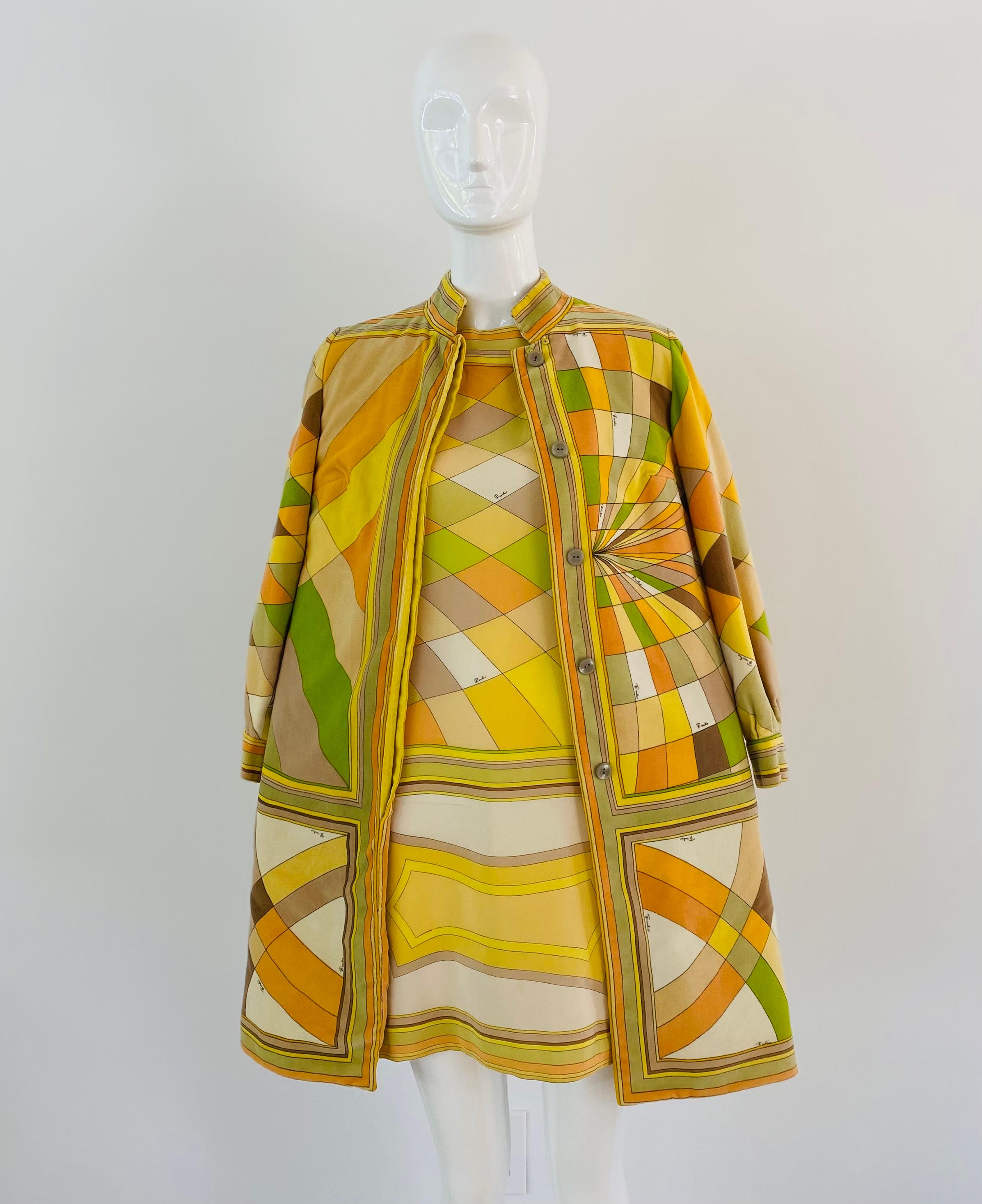 The 1960 Pucci classic velvet car coat is a stunning piece that showcases the designer's mastery of color and print. The coat is adorned with Pucci's signature print, featuring bold geometric shapes and swirling patterns in shades of yellow, green,