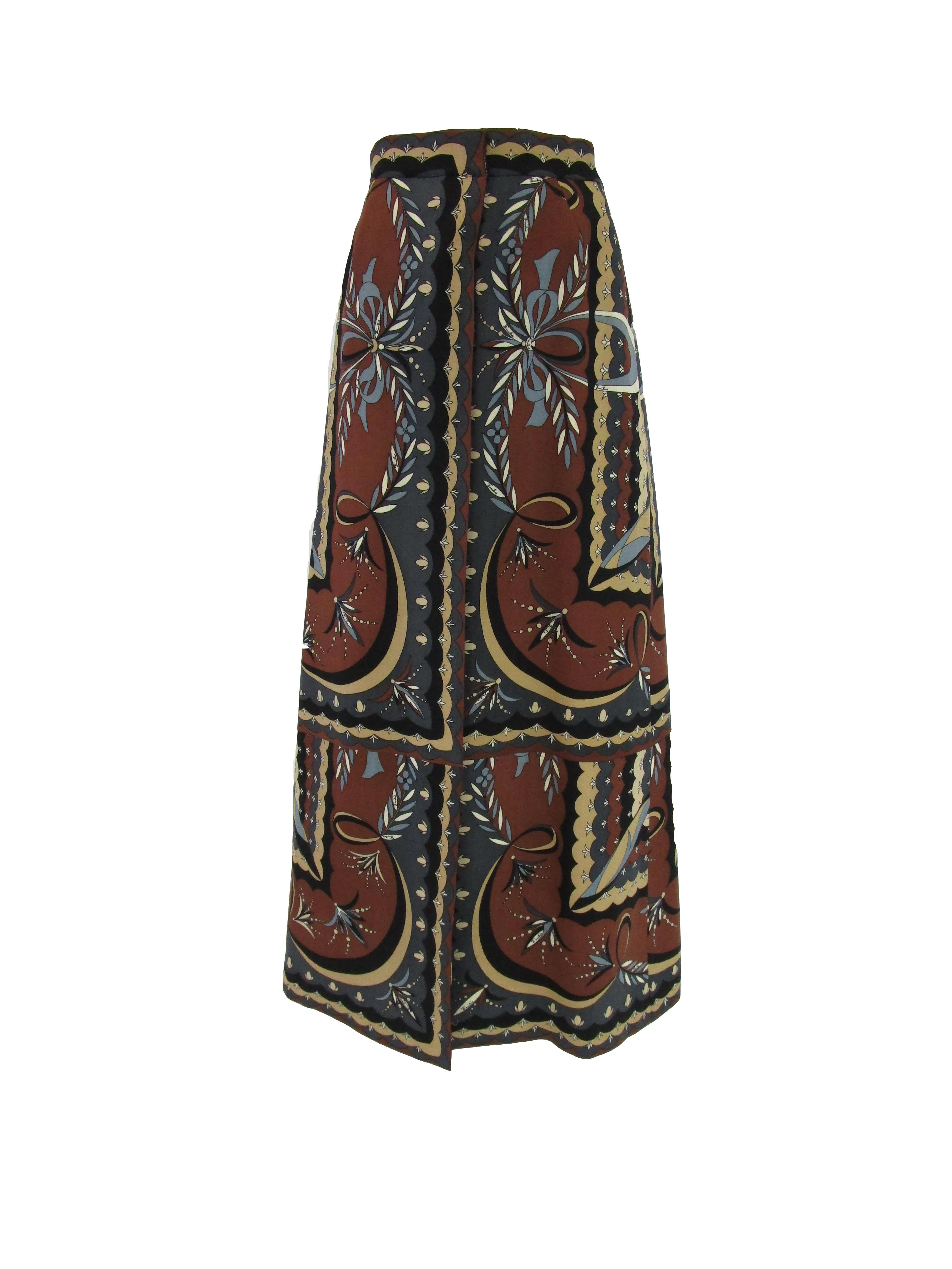 
Instantly captivating wrap skirt by Emilio Pucci!
It features Pucci's classic allover print, this one being a beautiful medley of earthy colors and interesting shapes.
This skirt features many women's favorite thing, pockets! The closure of this