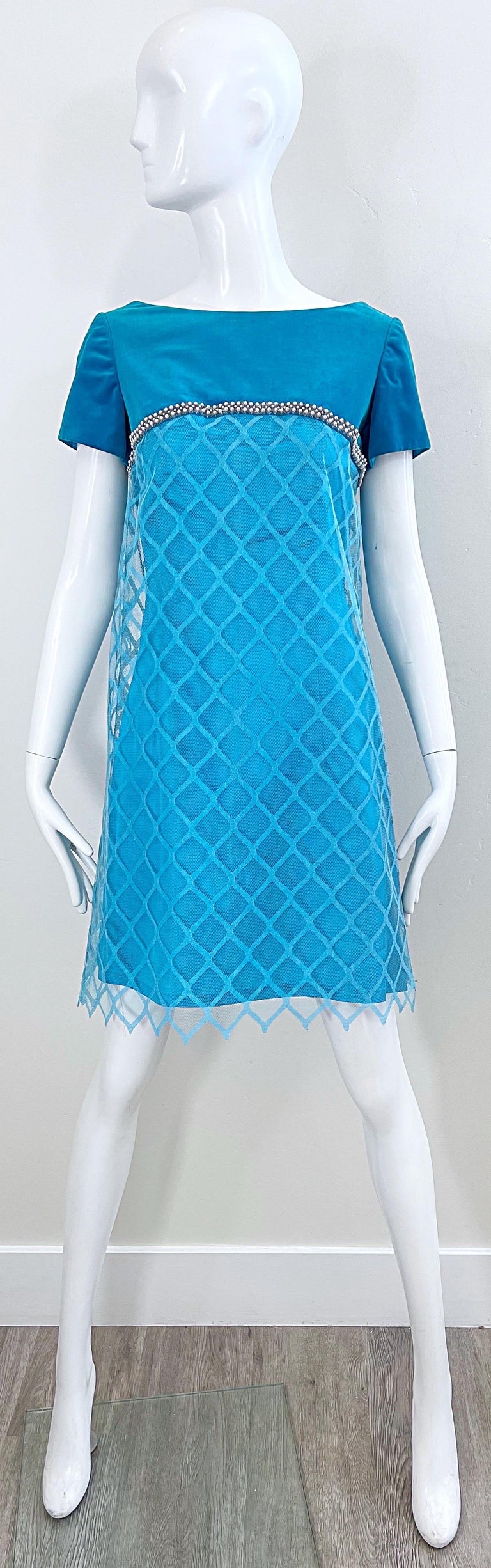 Chic EMMA DOMMB 1960s turquoise blue silk, rayon and velvet pearl encrusted dress ! Features a soft velvet above the bust. Silk / Rayon body with semi sheer mesh overlay. Tailored bodice with a slightly flared A-line body. Full metal zipper up the