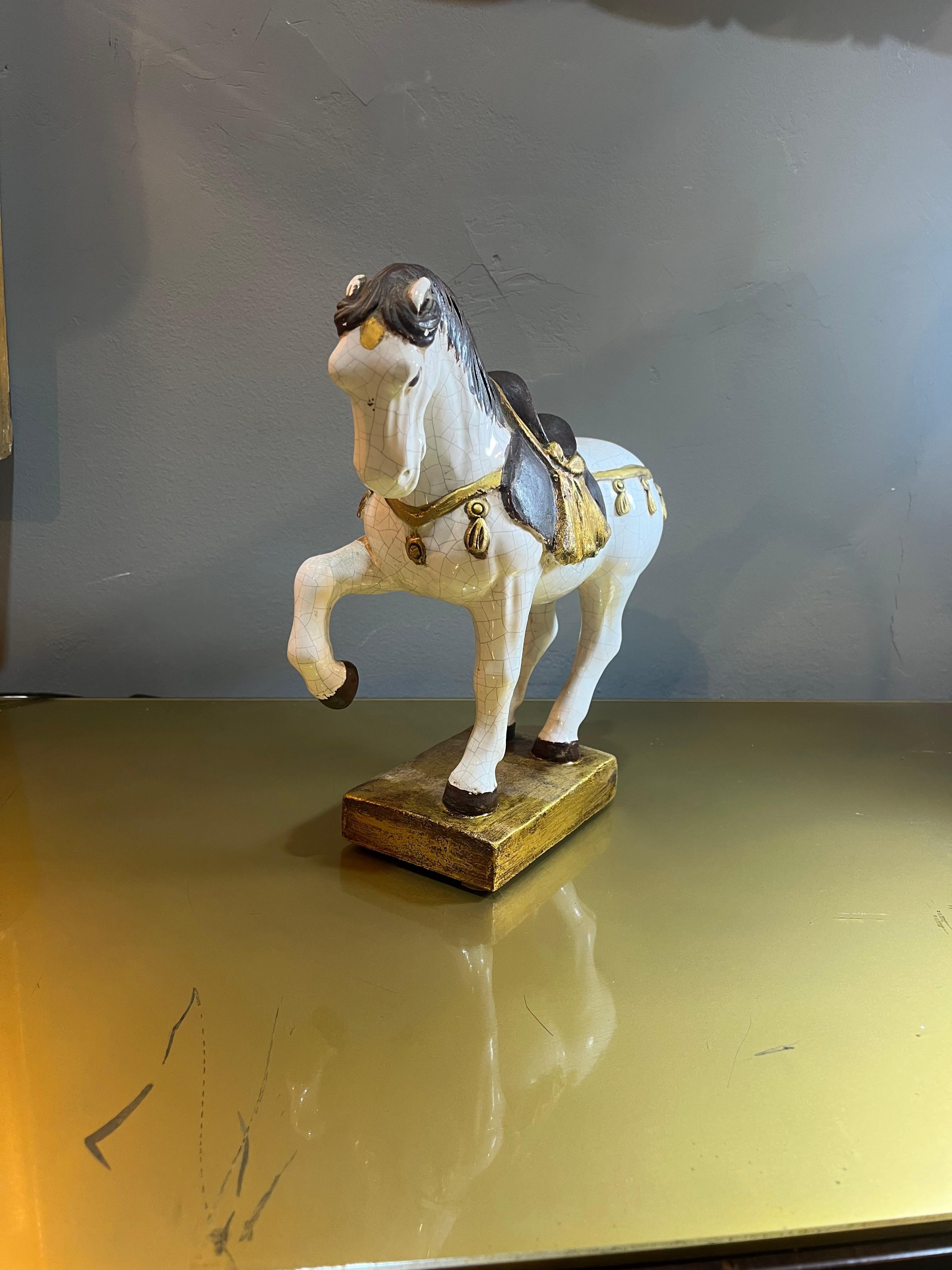 Zaccagnini prancing horse in enameled terracotta from the 60s. Product in good condition with small wear caused by the years and use. Please carefully view the attached images.