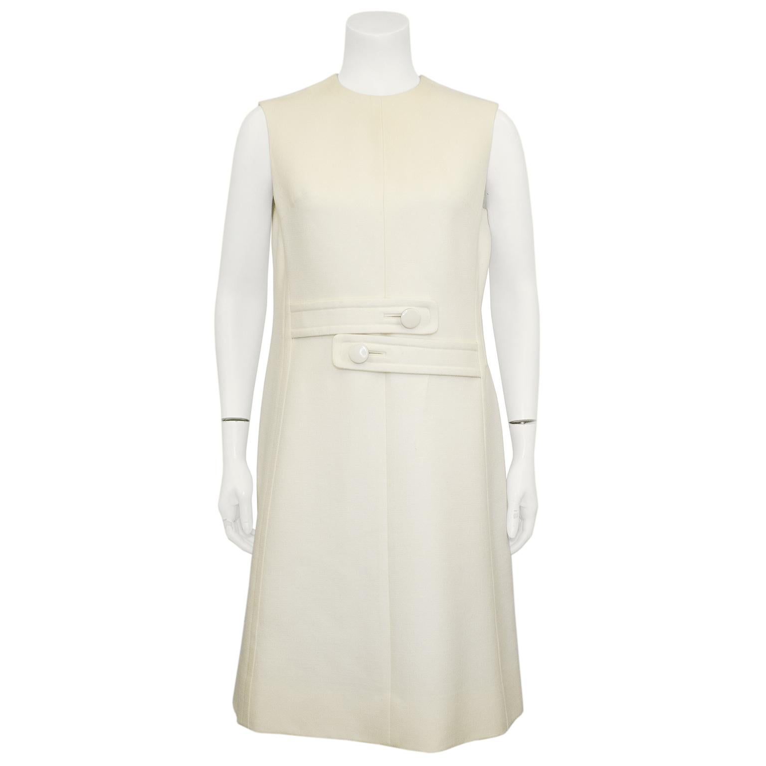 Very chic Sylvia Mills mod coat and dress ensemble from the 1960s. Double breasted coat with notched collar, slanted flap pockets and back centre seam inverted pleat vent. Dress is a classic sleeveless shift with lovely seaming details and invisible