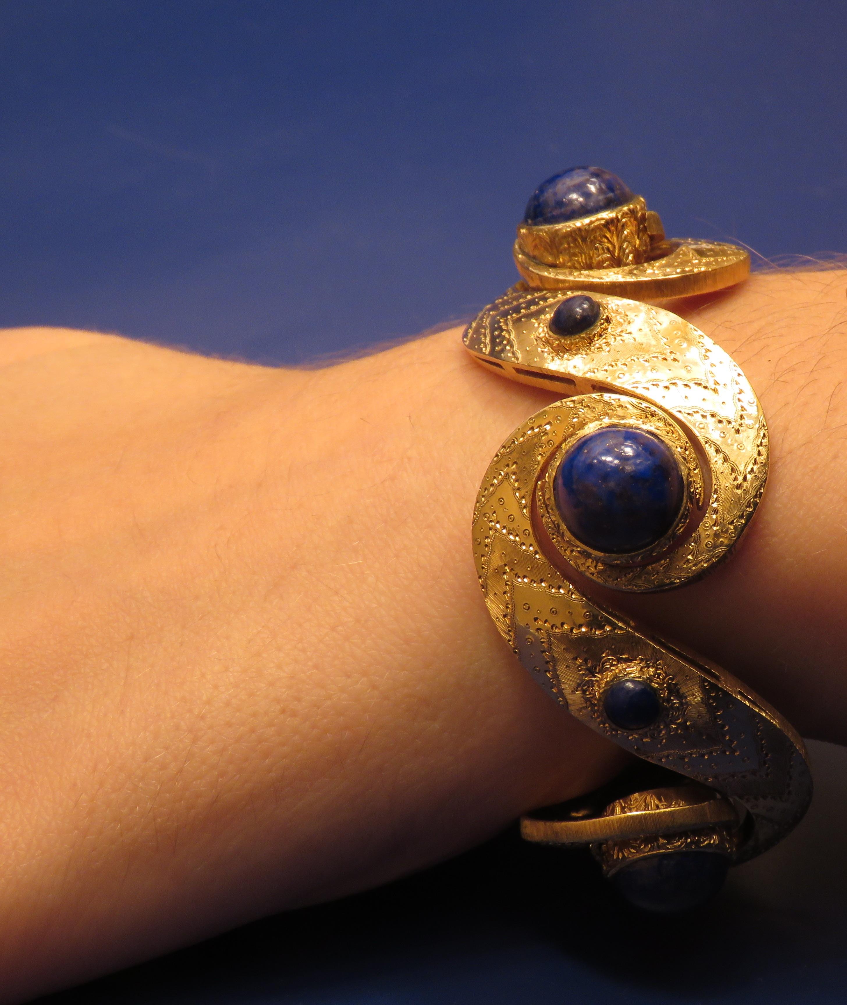 1960s Italian Fine Hand Engraving on Yellow Gold 18k Bracelet with Cabochon Lapis Lazuli
It  is stamped with the Italian Mark 750

________________________________________________________________________

Something about Botta Gioielli...

Botta