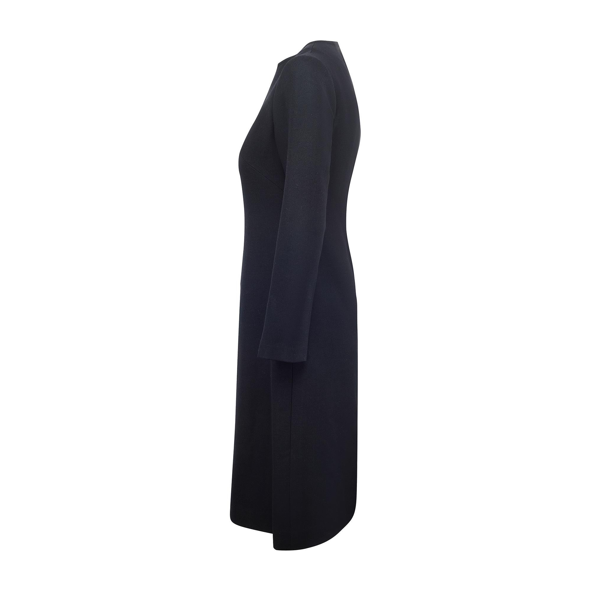 Cette robe moderne et raffinée a été fabriquée dans les années 1960 par Eric Hille, qui avait des concessions dans les grands magasins britanniques de l'époque, notamment Marshall and Snelgrove et Dickins and Jones. Cette robe est magnifiquement