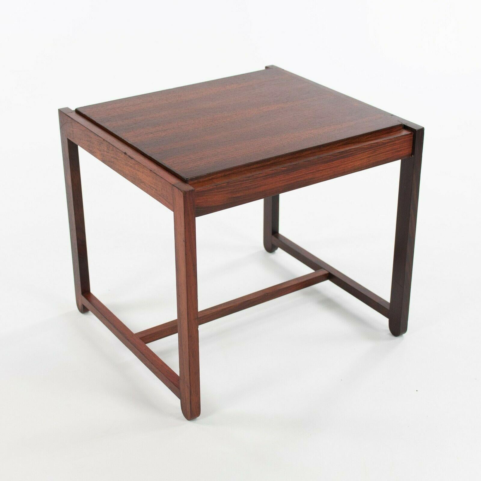 Listed for sale is a very rare flip top stool and end table, designed by Erik Buch and produced by O.D. Mobler (formerly Oddense Maskinsnedkeri) in Denmark. This gorgeous design was constructed from solid Brazilian rosewood and produced circa 1969.