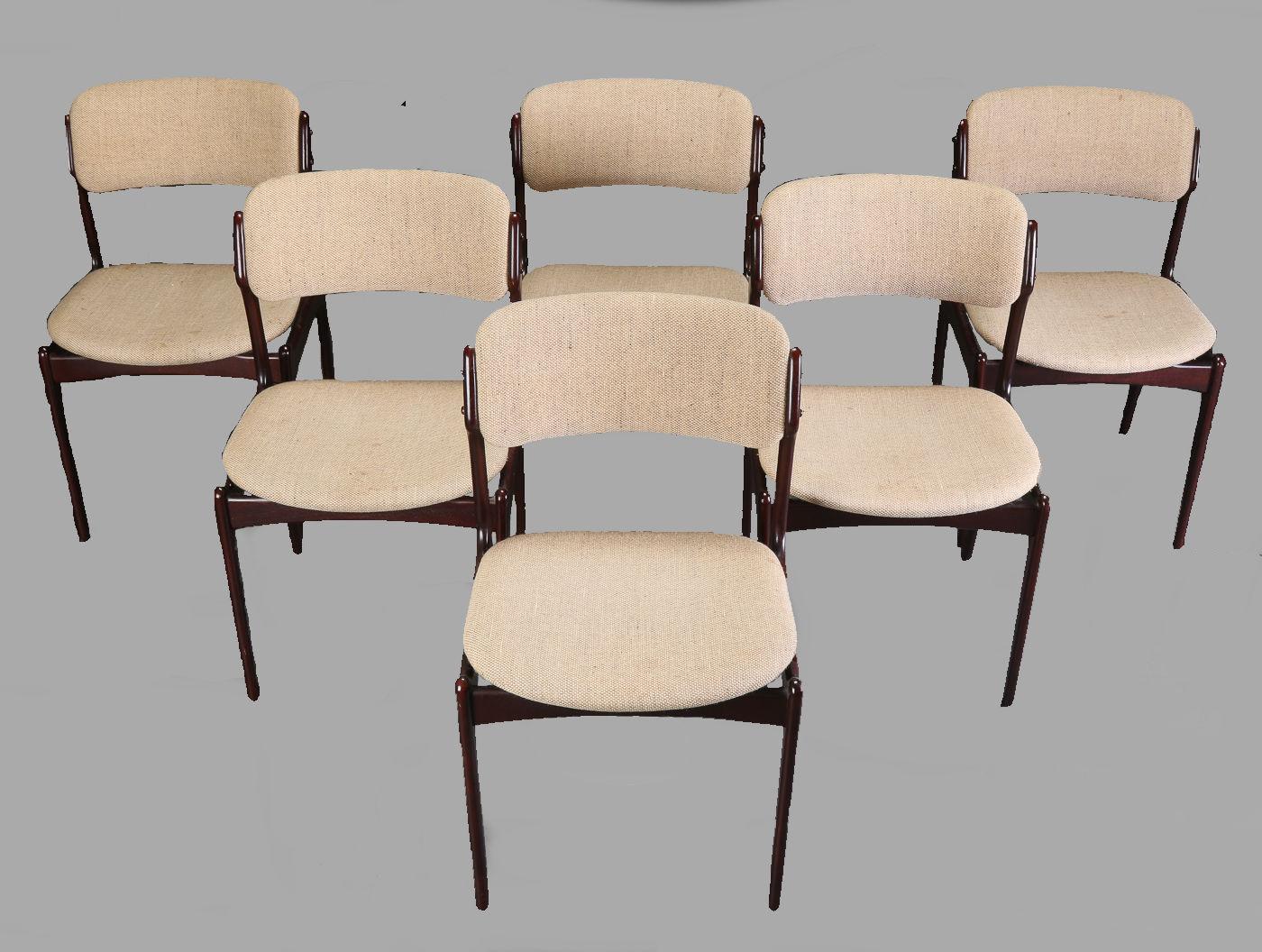 Set of six dining chairs in tanned oak with floating seat designed by Erik Buch for Oddense Maskinsnedkeri.

The chairs have a simple solid construction with elegant lines and a comfortable seating experience on the floating seat design that is