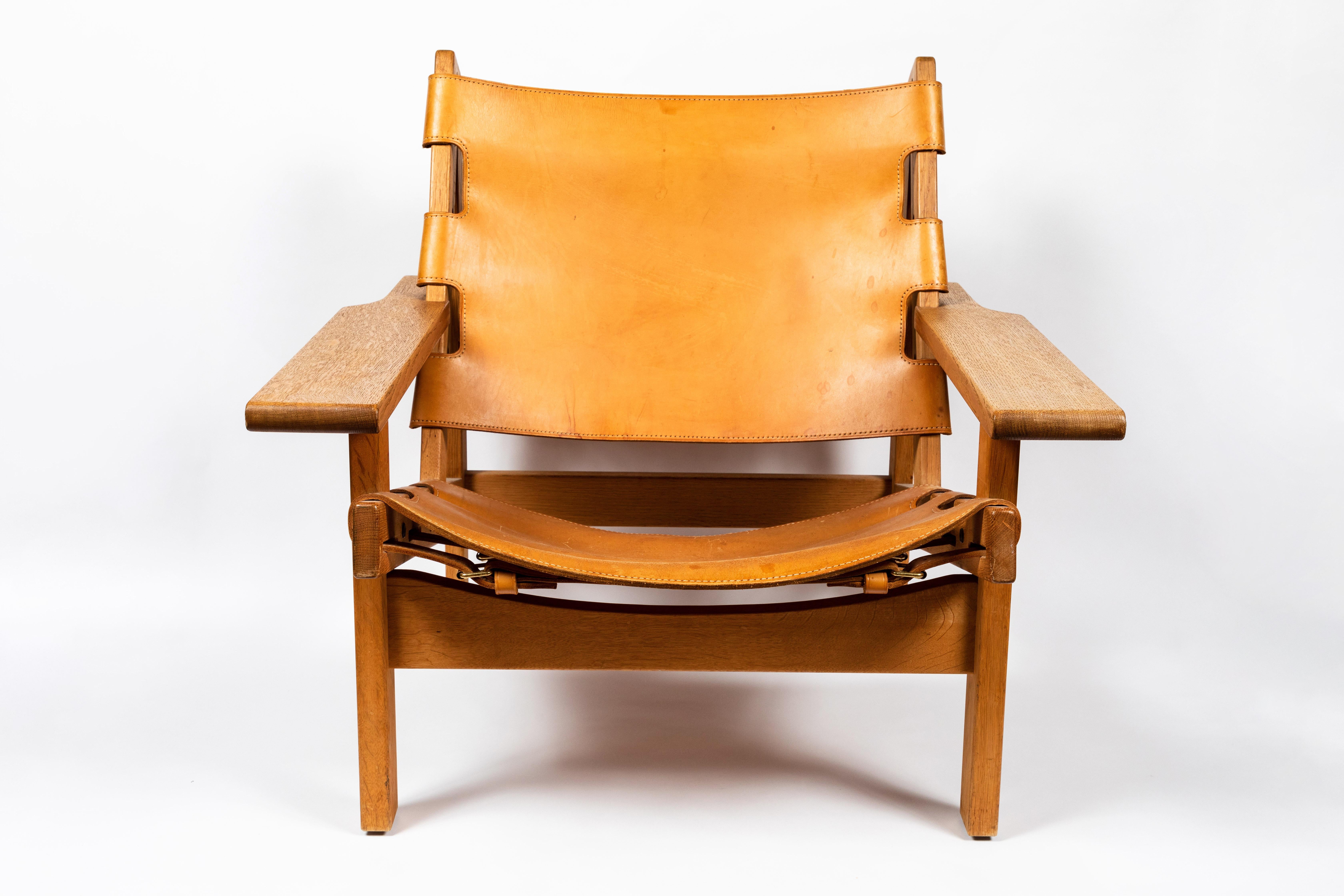 1960s Erling Jessen solid oak and cognac leather lounge chair. Executed in perfectly patinated cognac brown leather and richly grained solid oakwood. A quintessentially Scandinavian Modern chair by a master Danish designer whose exquisitely crafted