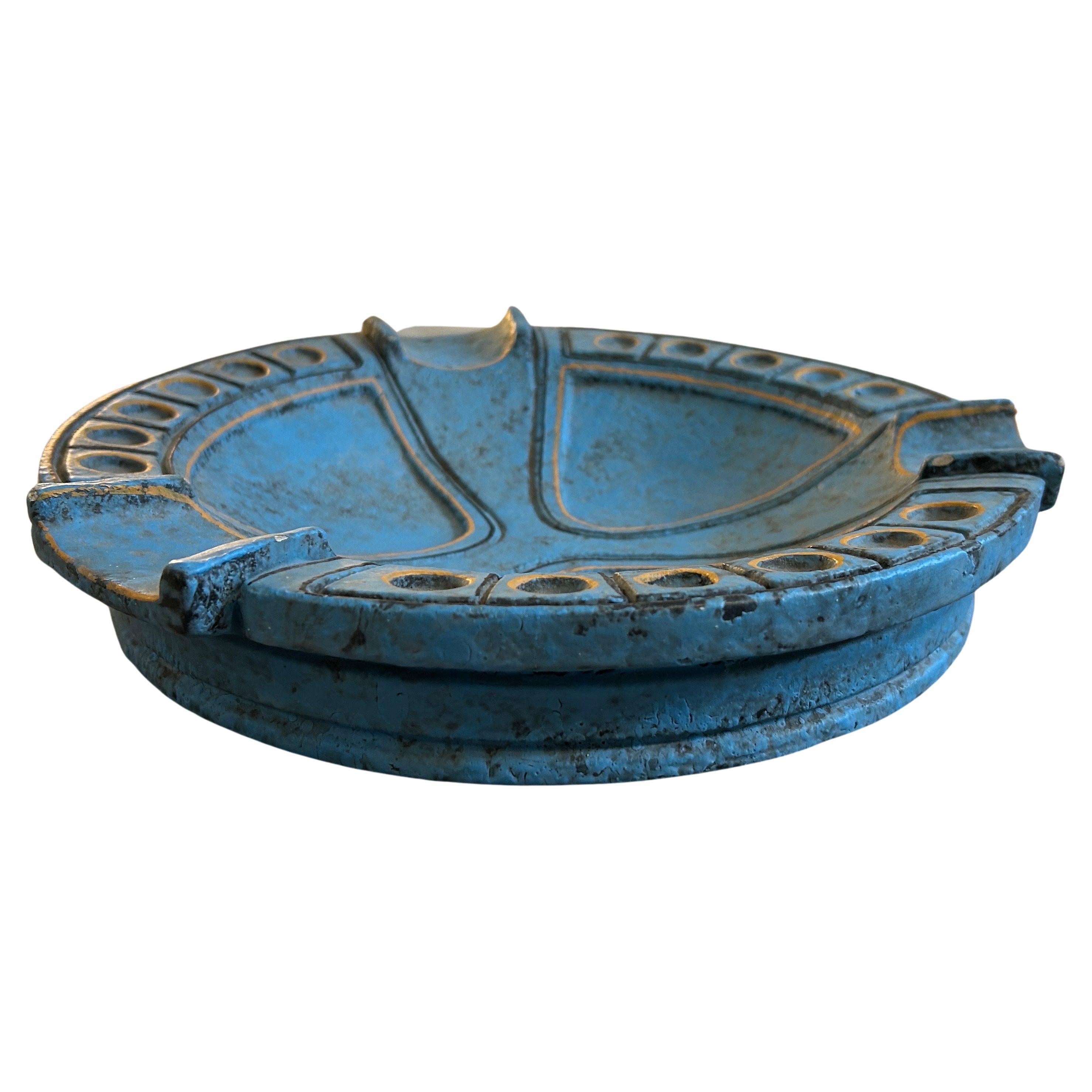 This Ceramic Italian Ashtray by Casucci in Chianciano is a unique and visually captivating decorative piece that pays homage to the Etruscan art and design influences of the 1960s. The ashtray is made of ceramic, a versatile and traditional material
